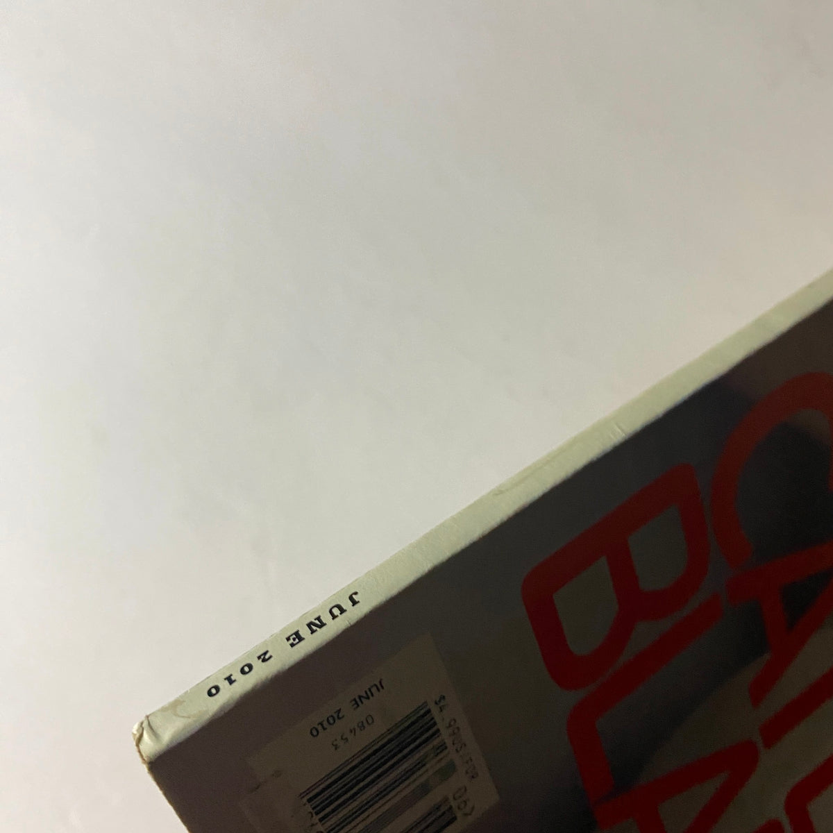 Side view of W Magazine June 2010 indicating the publication date with a focus on the title and month.