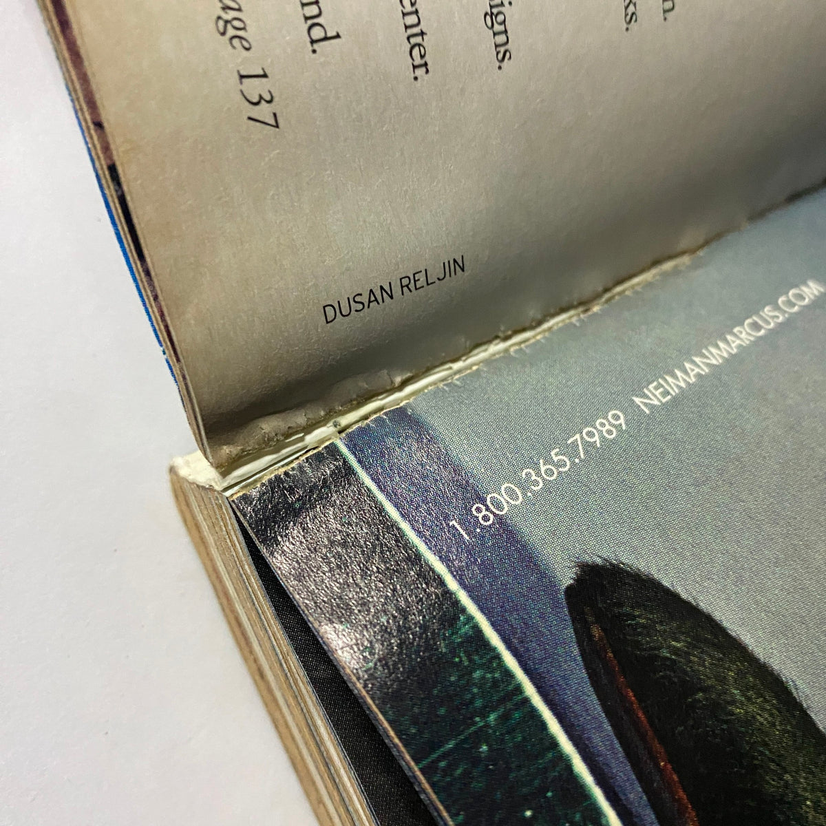 Inside shot of W Magazine September 2004 showing the lightweight spine and binding detail, highlighting the publication's vintage charm.