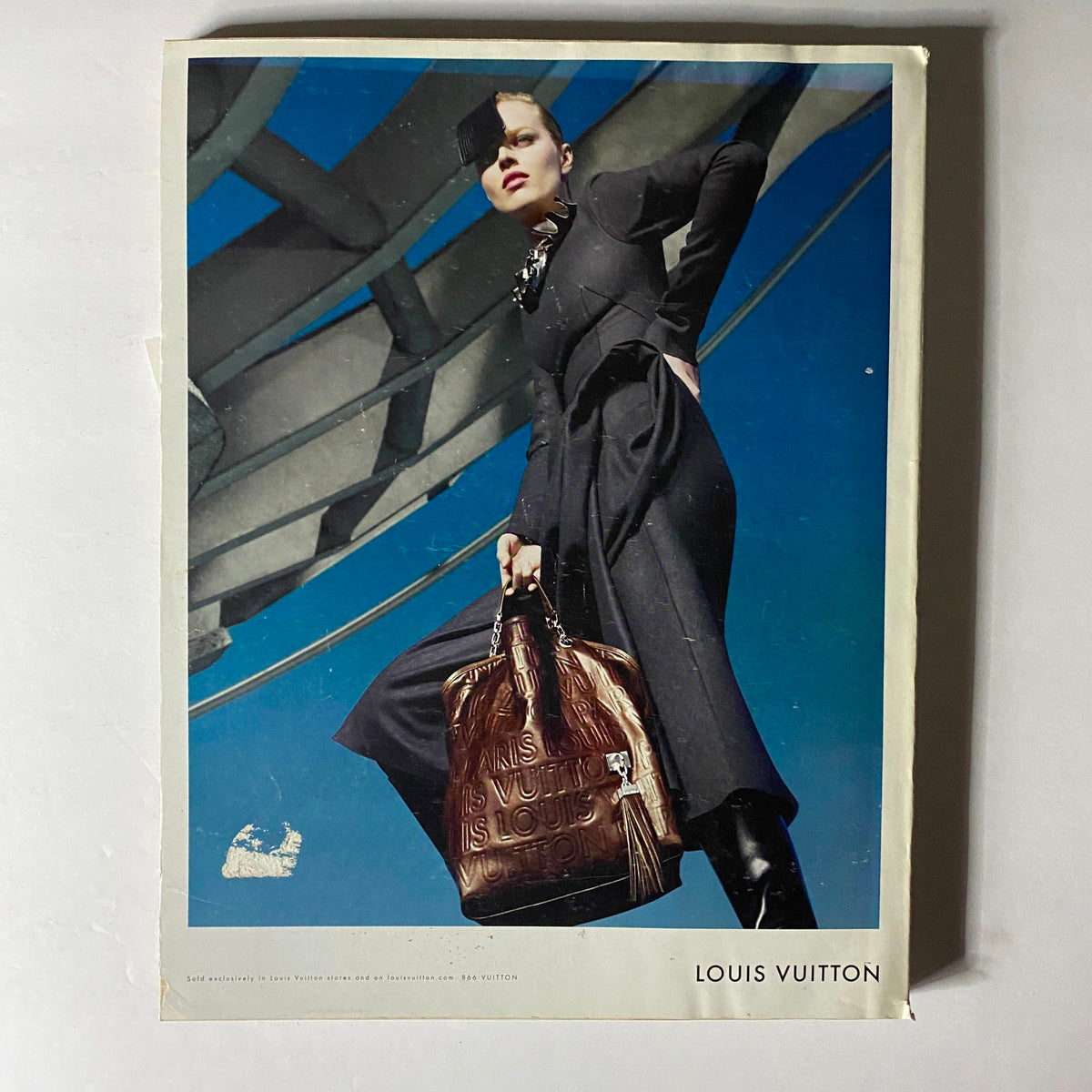 Louis Vuitton advertisement included in W Magazine November 2008, showcasing a model in a striking outfit holding a branded handbag against a colorful background.
