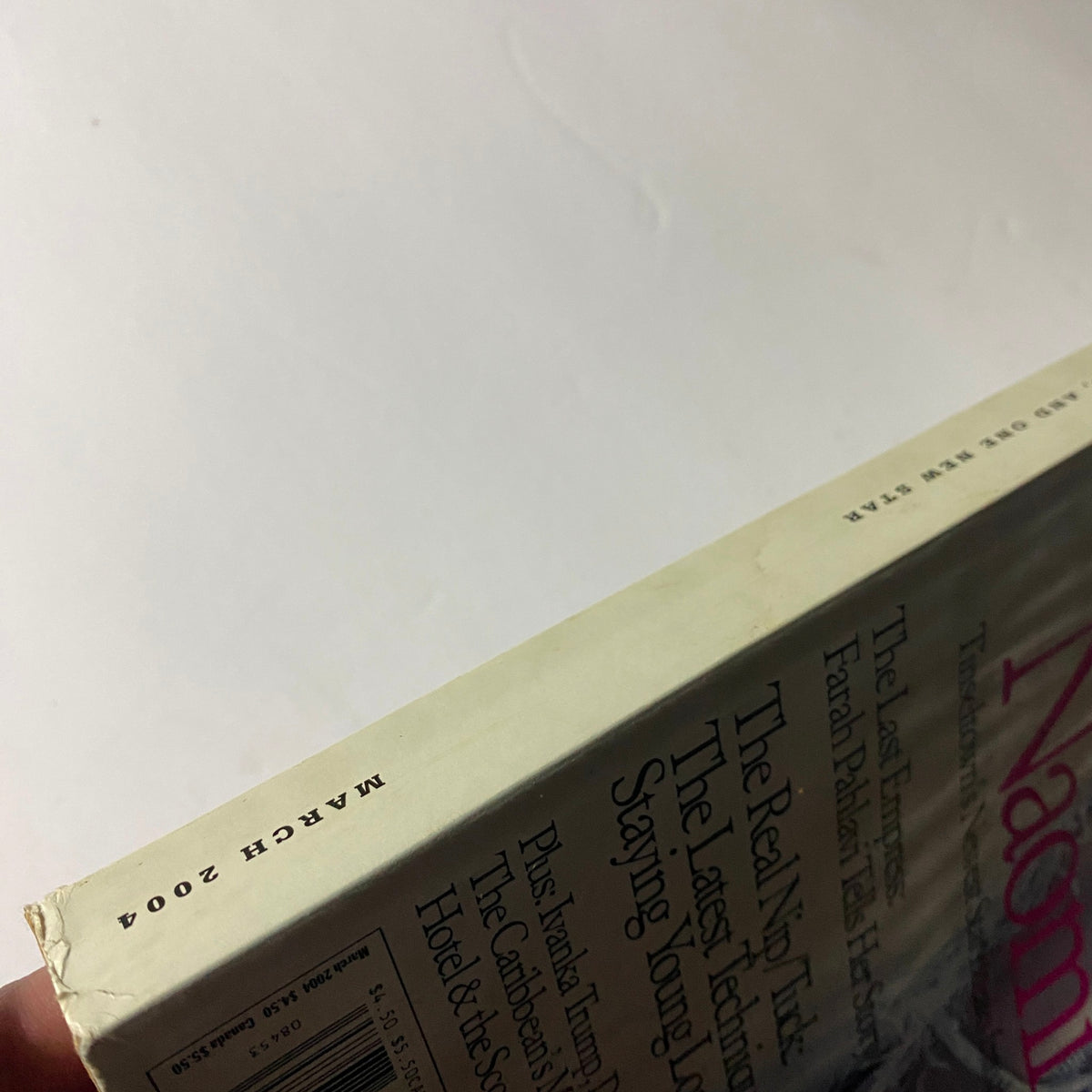 Spine view of W Magazine March 2004, highlighting the publication date printed on the edge.
