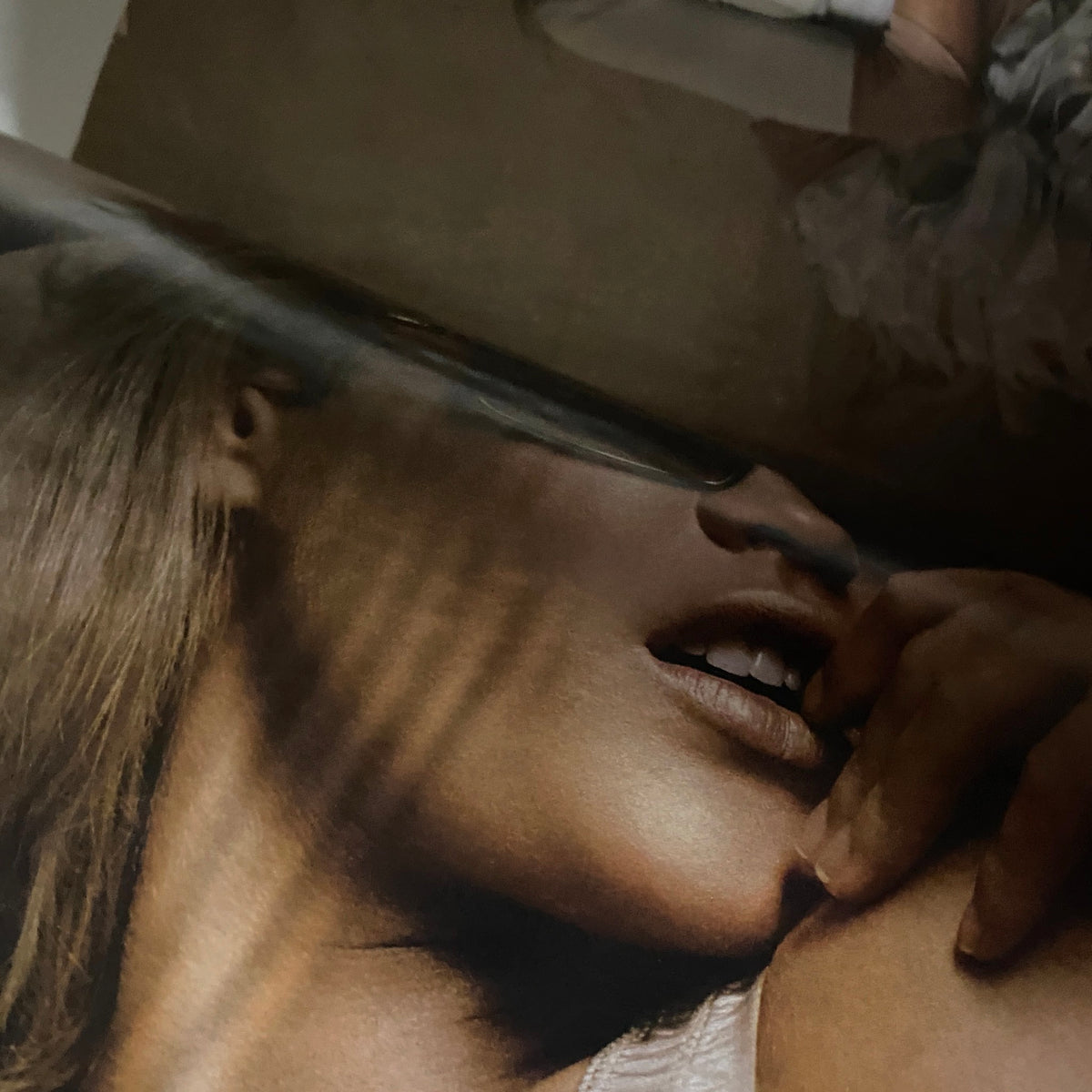 Artistic close-up of a model's mouth from W Magazine March 2004, capturing the essence of early 2000s fashion.