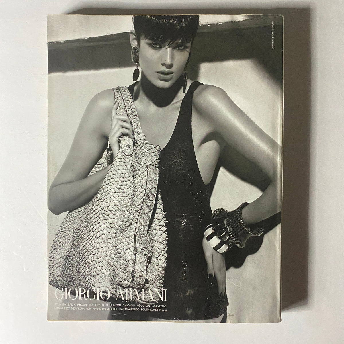 Giorgio Armani advertisement featured in W Magazine March 2008 highlighting an elegant model with a stylish large handbag, representing luxury fashion aesthetics.
