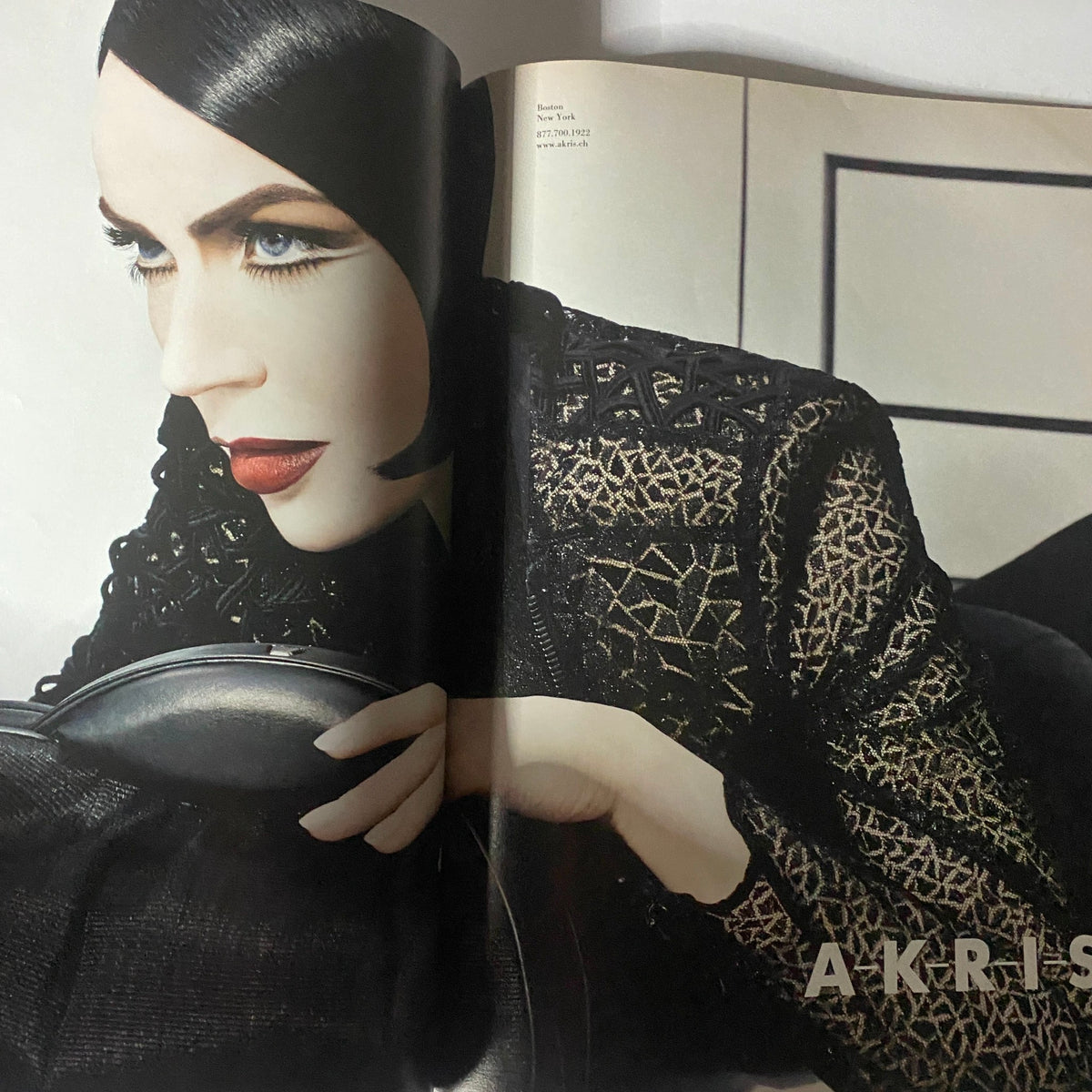 Fashion editorial page from W Magazine February 2010 showcasing a model in a stylish Akris outfit.