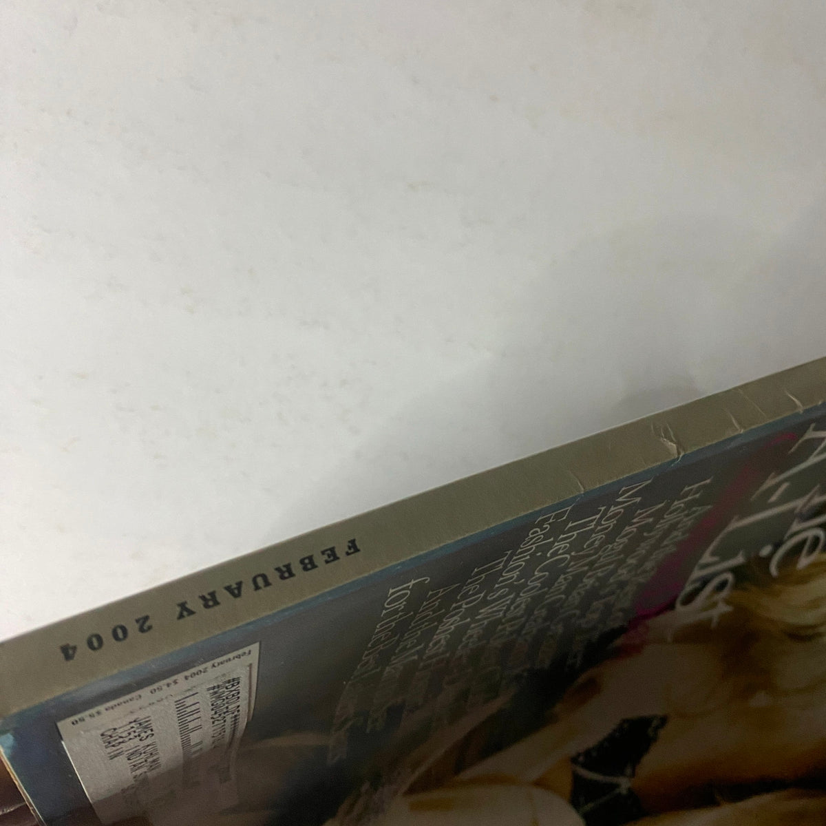 Side view of W Magazine February 2004, displaying the publication's spine and publication date, emphasizing its collectible status.