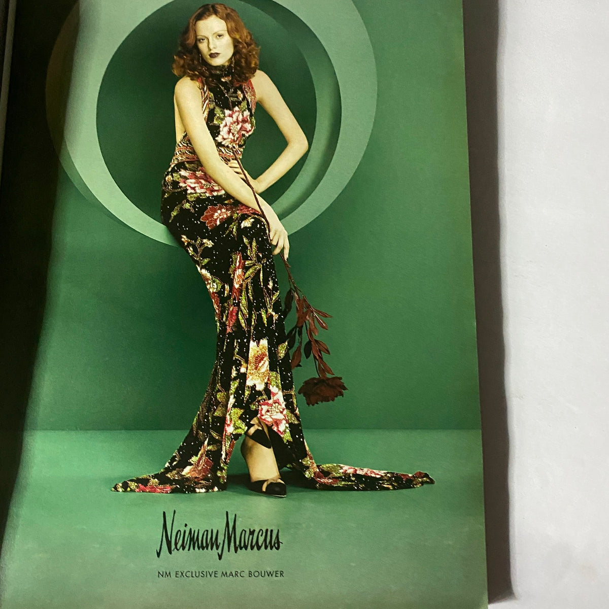 W Magazine February 2004 The A-List Cameron Diaz Cover featuring an advertisement for Neiman Marcus showcasing a model in a stunning floral gown with a green backdrop.