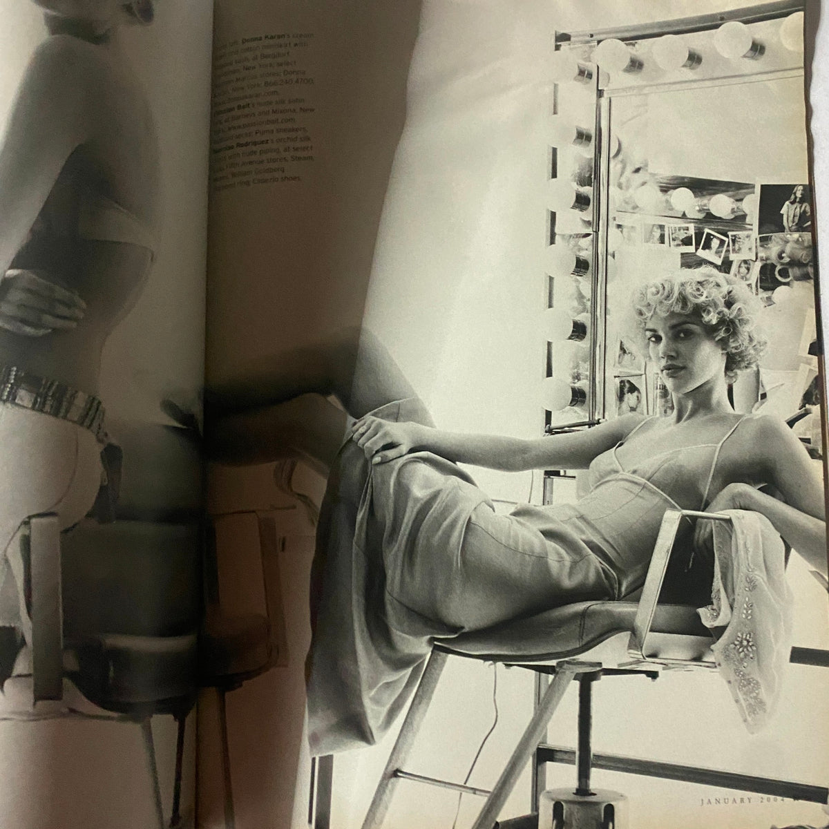 W Magazine January 2004 Gisele Bündchen Cover VG featuring a stunning black and white fashion editorial with a model posed in a chic outfit at a makeup station, showcasing the elegance and style of the early 2000s.