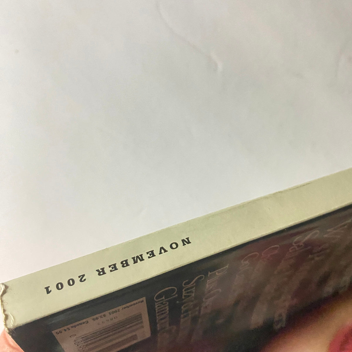 Spine view of W Magazine November 2001, highlighting the vintage publication's date and design.