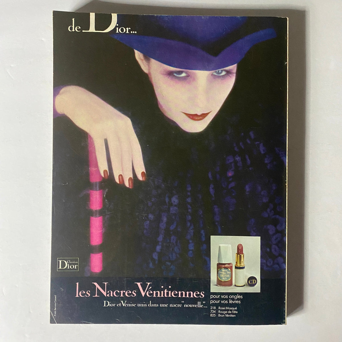 Advertisement page from Vogue Paris Magazine September 1975 for Christian Dior, promoting nail polish and lipstick with a glamorous model.