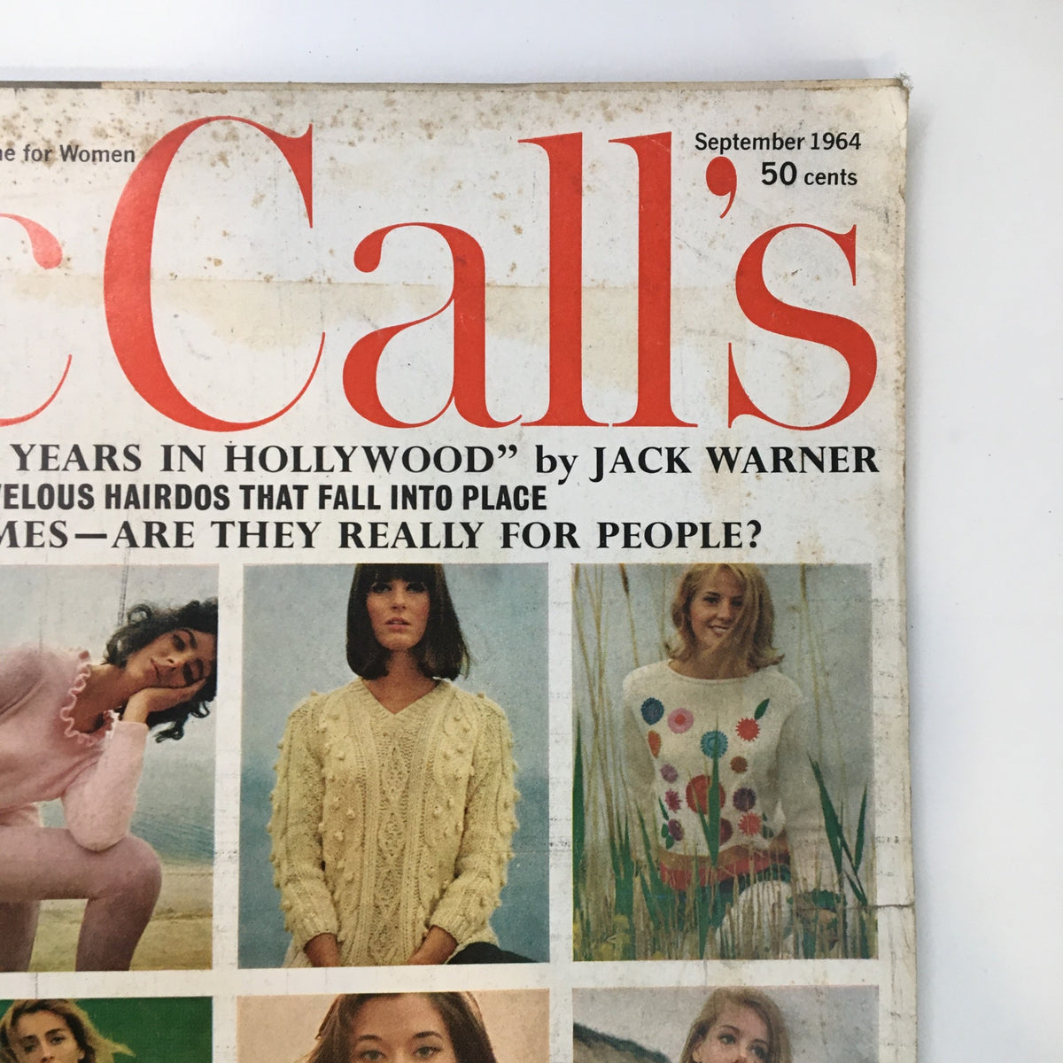Close-up of the Vintage McCall's Magazine September 1964 cover displaying the magazine title and themes of Hollywood and fashion.