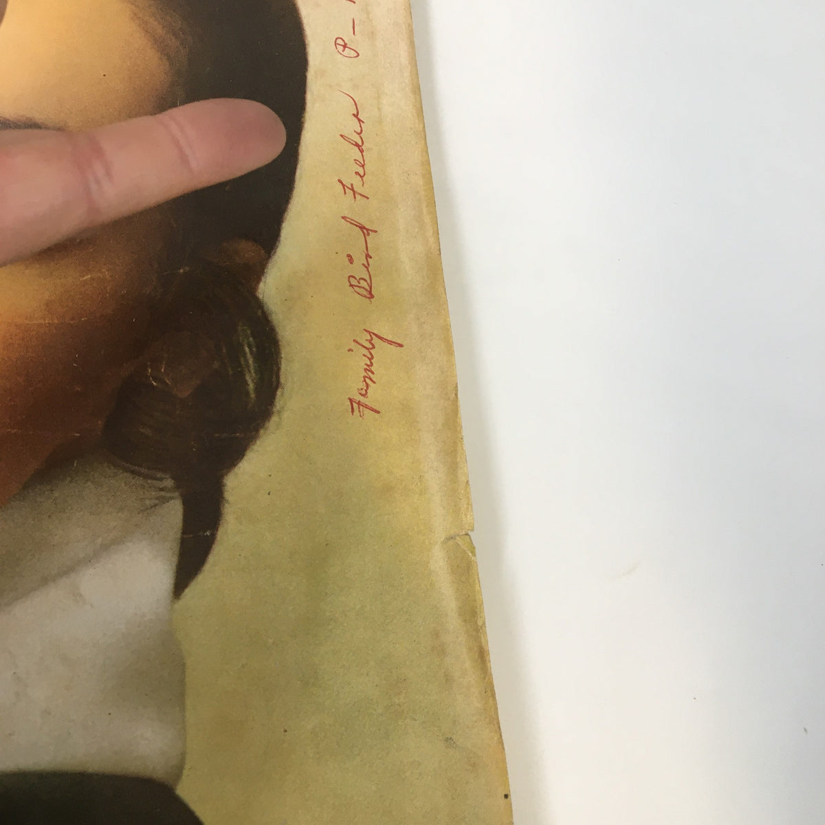 Detail of the VTG McCall's Magazine February 1969 cover, focusing on handwritten notes and wear, reflecting the vintage charm and history of the publication discussing Jessamyn West's views on President Nixon.