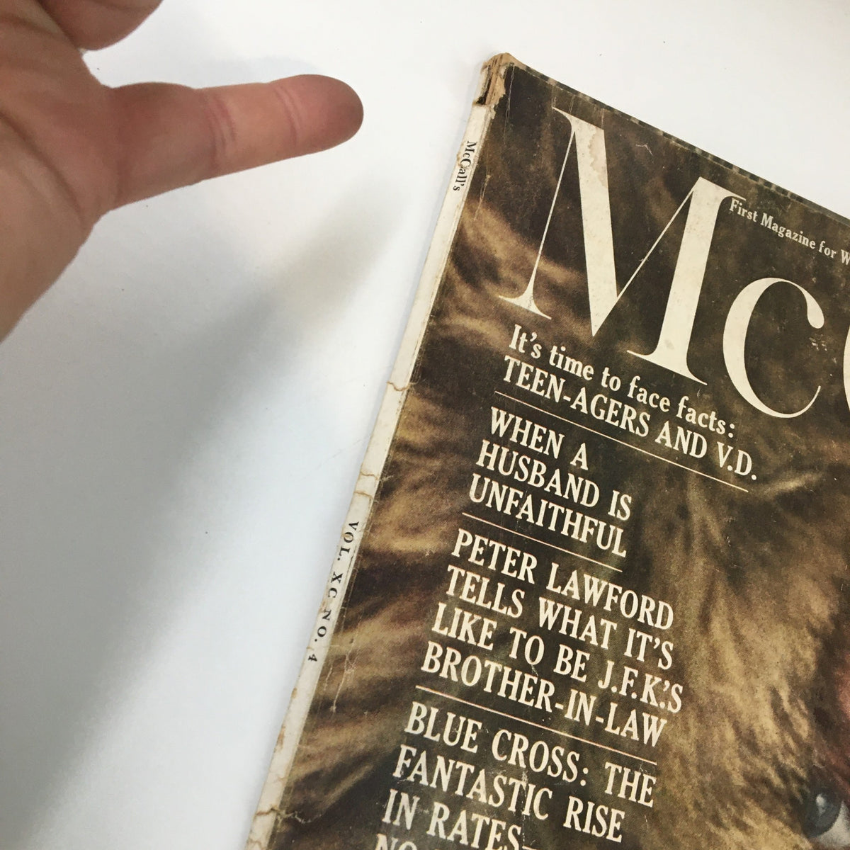 Side view of the cover of VTG McCall's Magazine January 1963 emphasizing the magazine's title and listing features including Peter Lawford as JFK's brother-in-law.