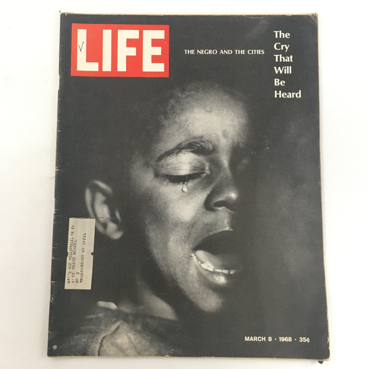 Cover of Life Magazine, March 8, 1968, featuring the title 'The Negro and the Cities, Cry That Will Be Heard'. The image showcases a poignant, emotive photograph of a boy with a tear, symbolizing the struggles faced by African American communities during the 1960s.