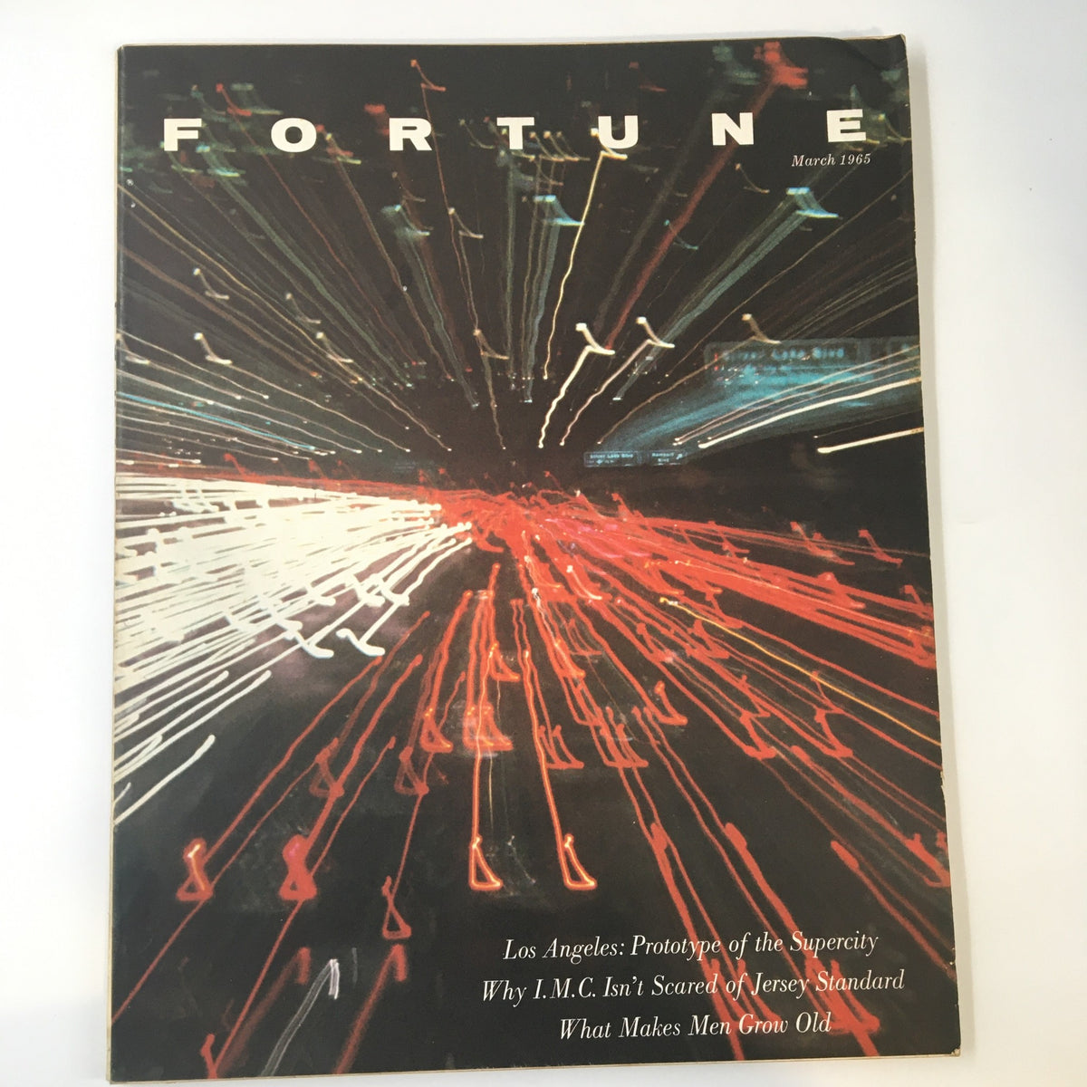 Cover of VTG Fortune Magazine March 1965 featuring the title 'Los Angeles Prototype of the Supercity' with dynamic lights and designs illustrating urban movement.
