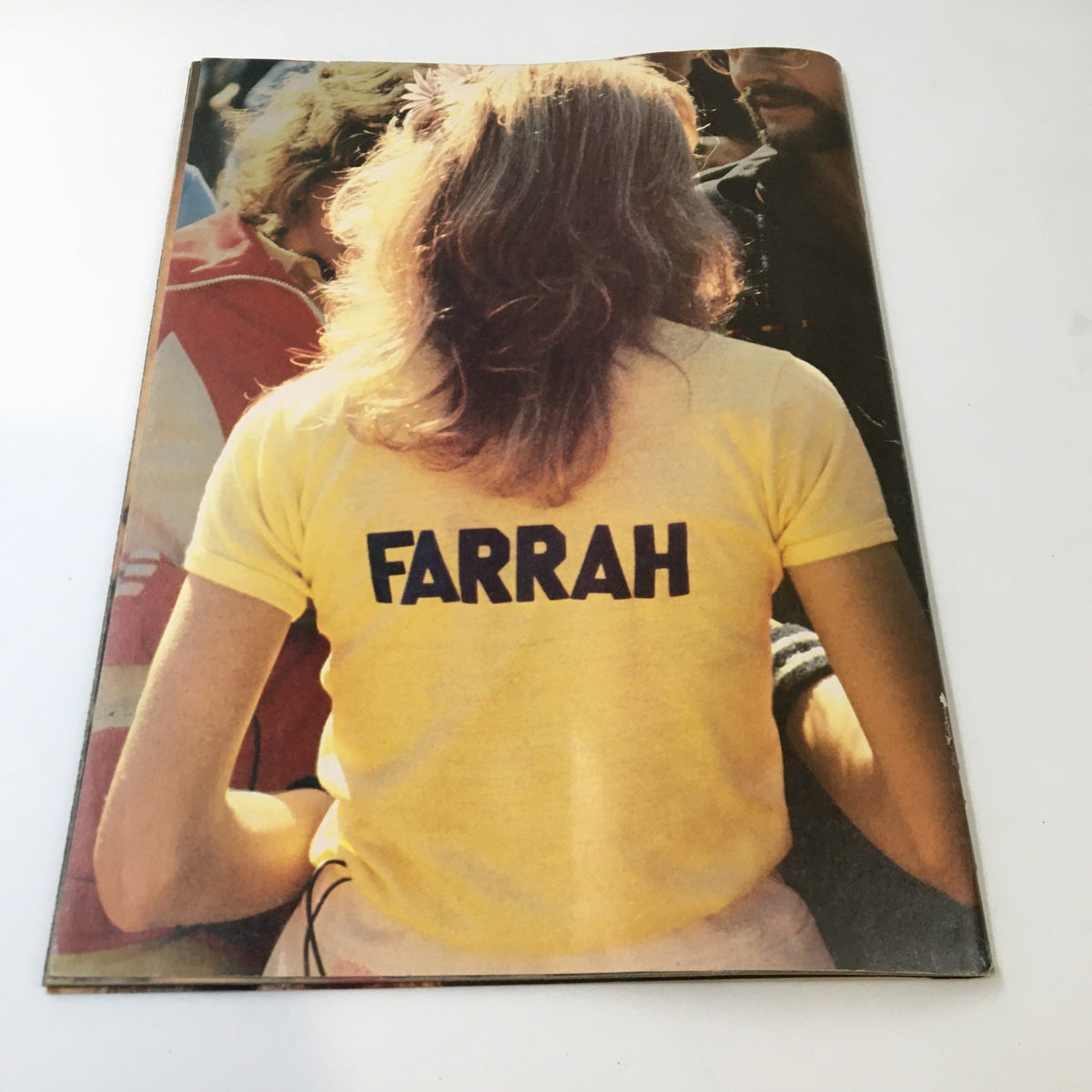 Back cover of the VTG TV Superstar Magazine October 1977 showing Farrah Fawcett from behind, wearing a yellow shirt with her name, reflecting her icon status in the 1970s.