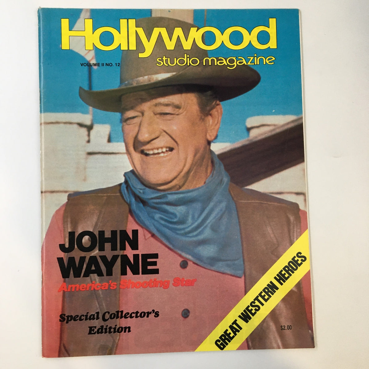 Vintage Hollywood Studio Magazine from 1978 featuring John Wayne, titled 'America's Shooting Star'. The cover showcases John Wayne smiling while wearing a cowboy hat and a blue scarf, representing classic American cinema.