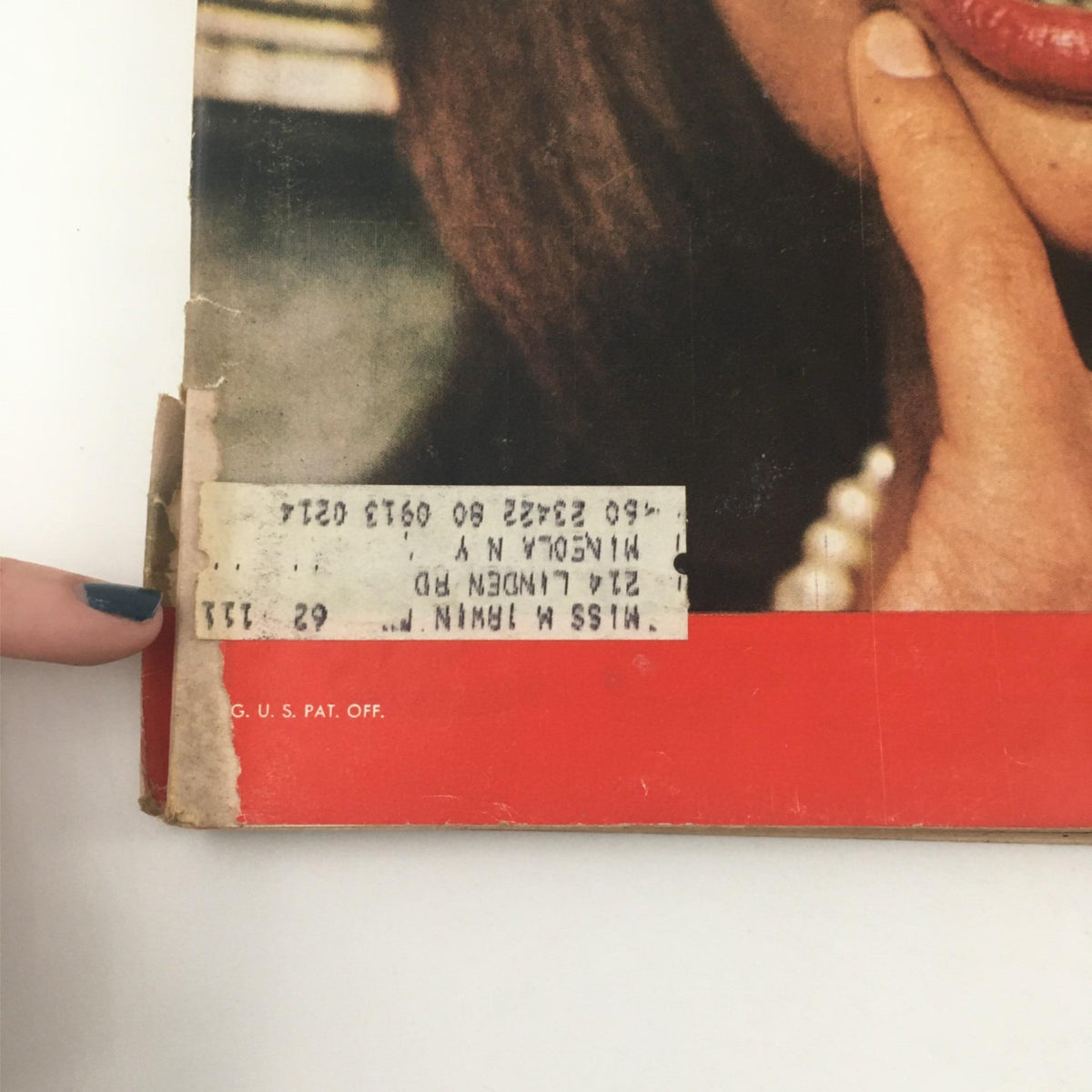 Close-up of the edge of a vintage Life Magazine from November 14, 1960, showing the address label and slight wear, emphasizing its collectible nature.