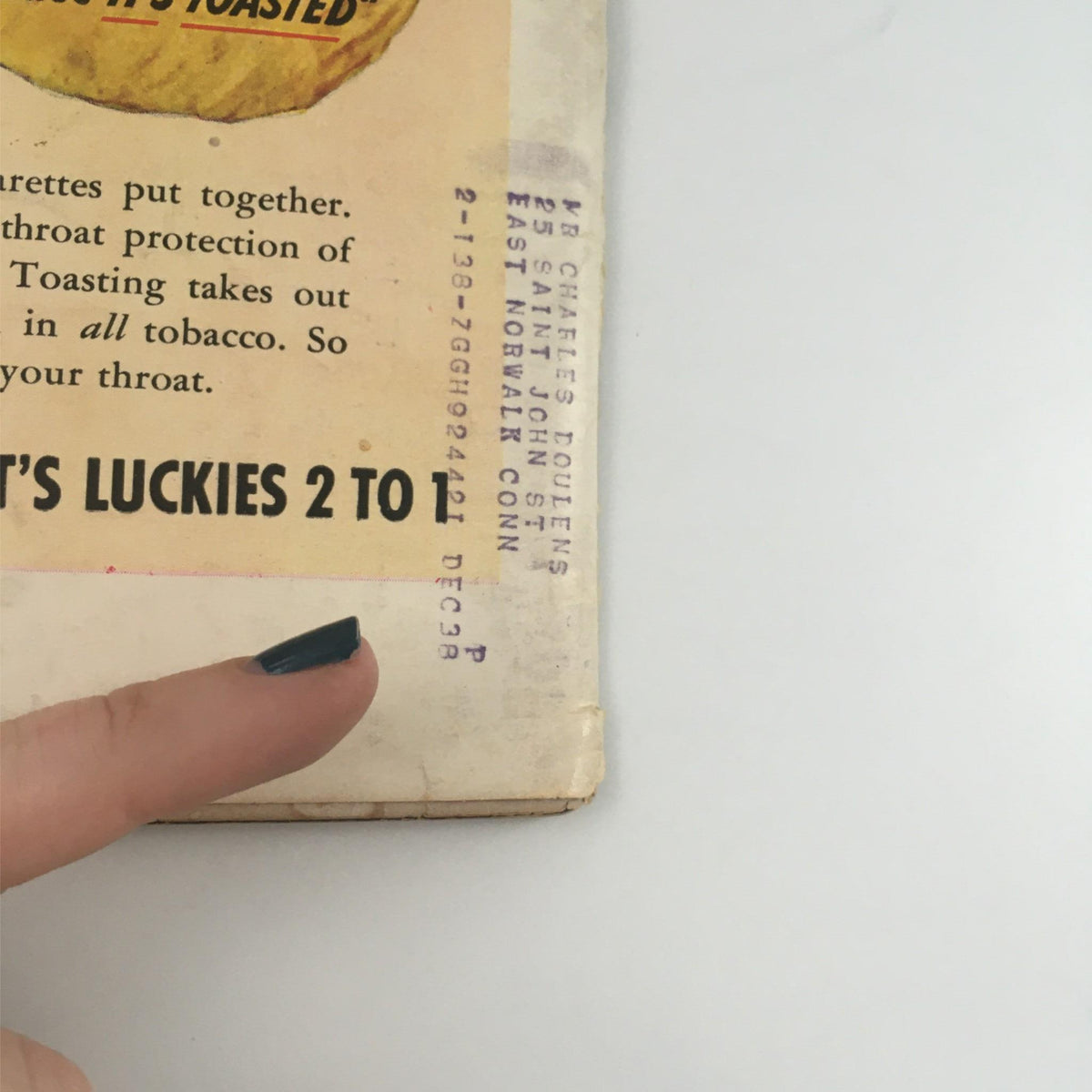 Back cover of Vintage Life Magazine December 12, 1938 displaying 'It's Luckies 2 to 1' advertisement, supplemented with historical details and a finger pointing, capturing the essence of mid-20th century advertising.