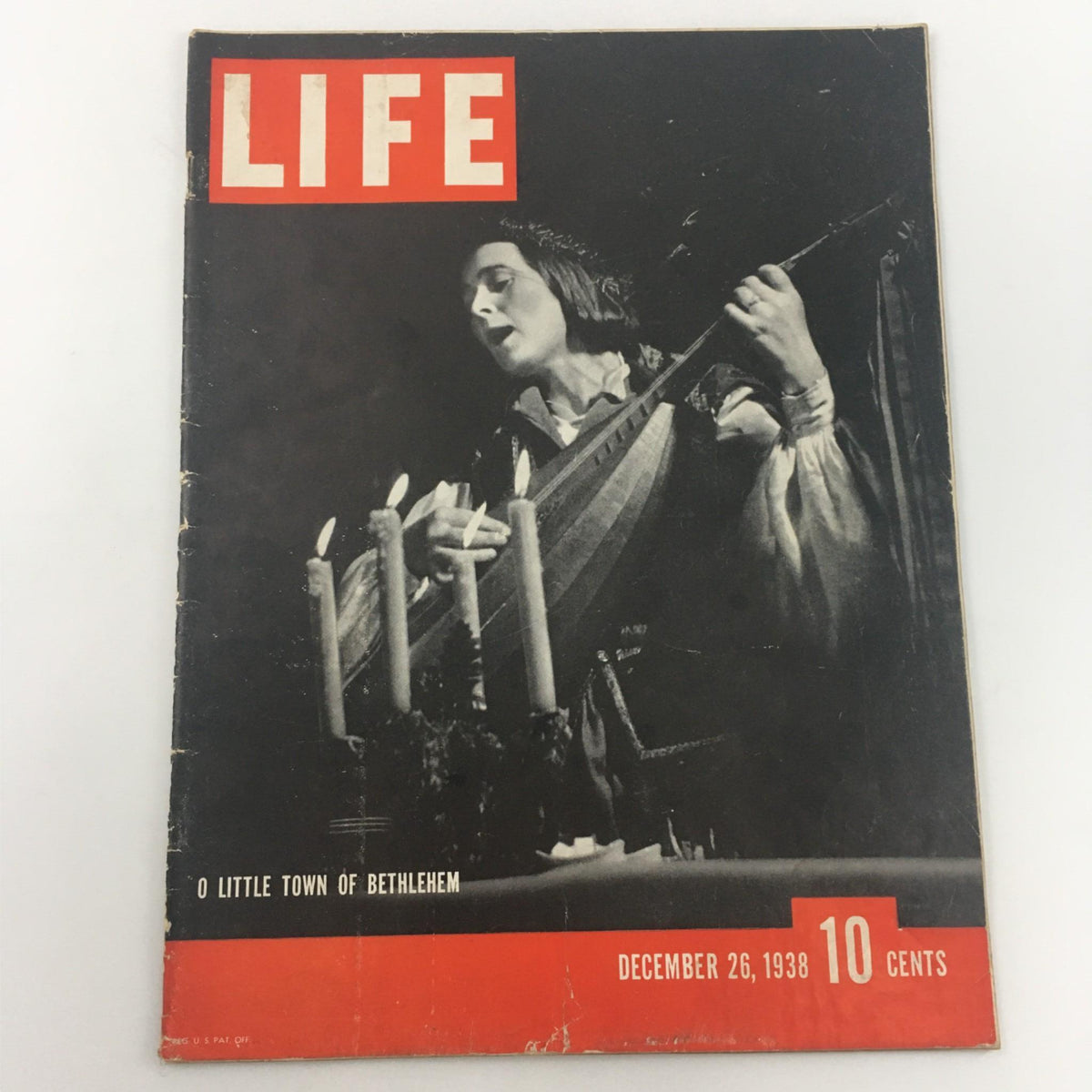 Cover of VTG Life Magazine from December 26, 1938 featuring the title 'O Little Town Of Bethlehem' by Ollo Baldauf, showcasing a performer holding a stringed instrument with candles.