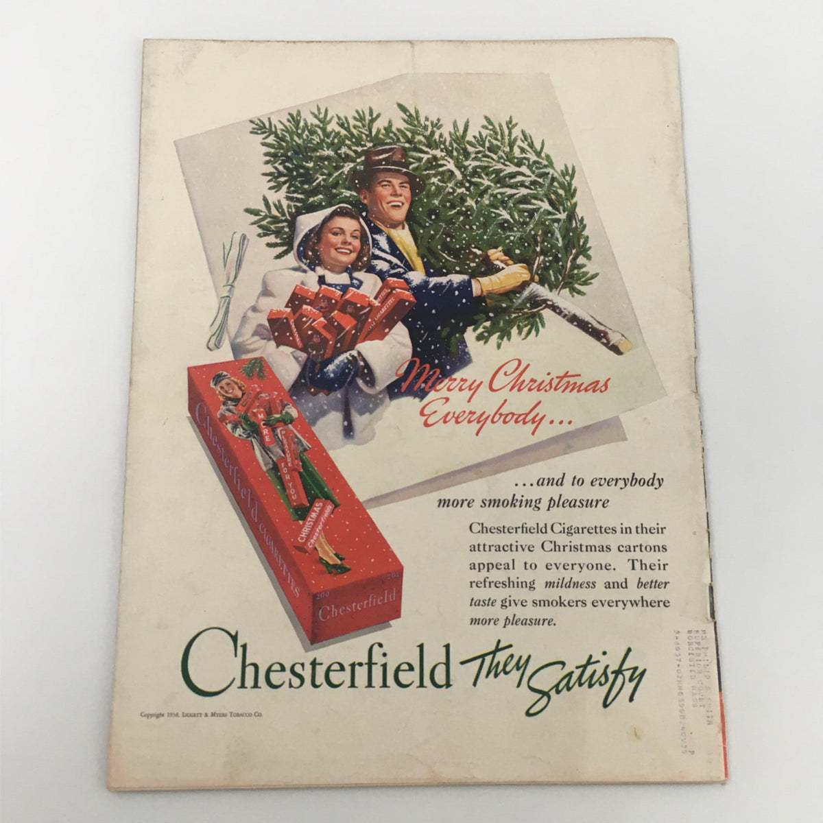 Back cover of VTG Life Magazine from December 26, 1938 featuring a vintage advertisement for Chesterfield Cigarettes with a festive Christmas theme and two individuals enjoying the holiday.