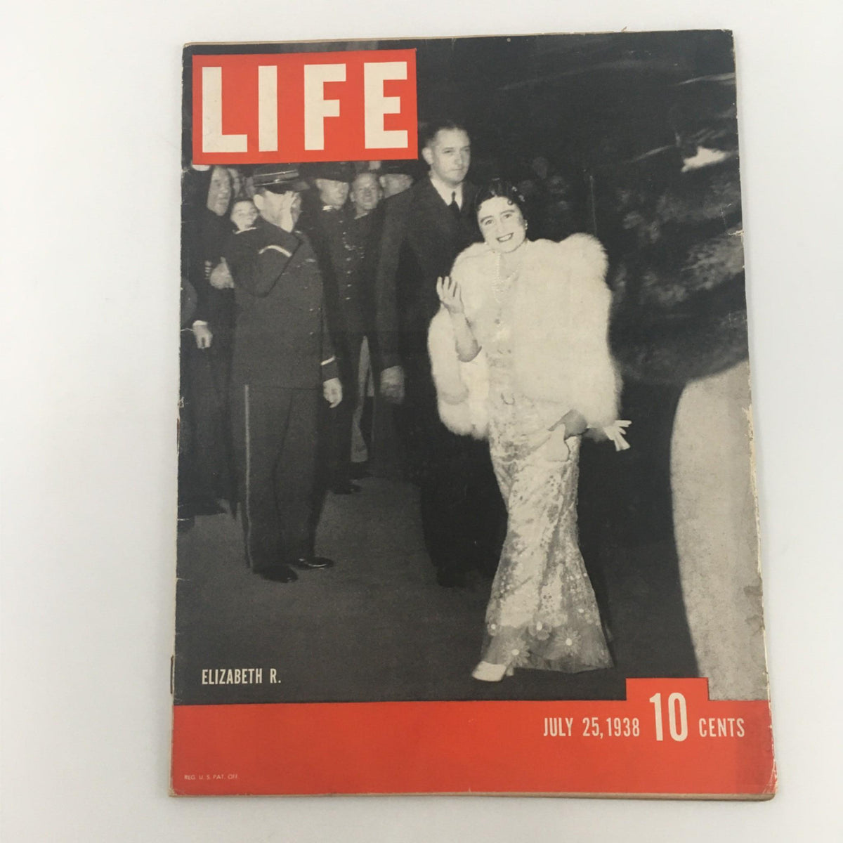 Cover of VTG Life Magazine from July 25, 1938 featuring Queen Elizabeth of England, showcasing a black and white image with Queen Elizabeth dressed elegantly and surrounded by a crowd.