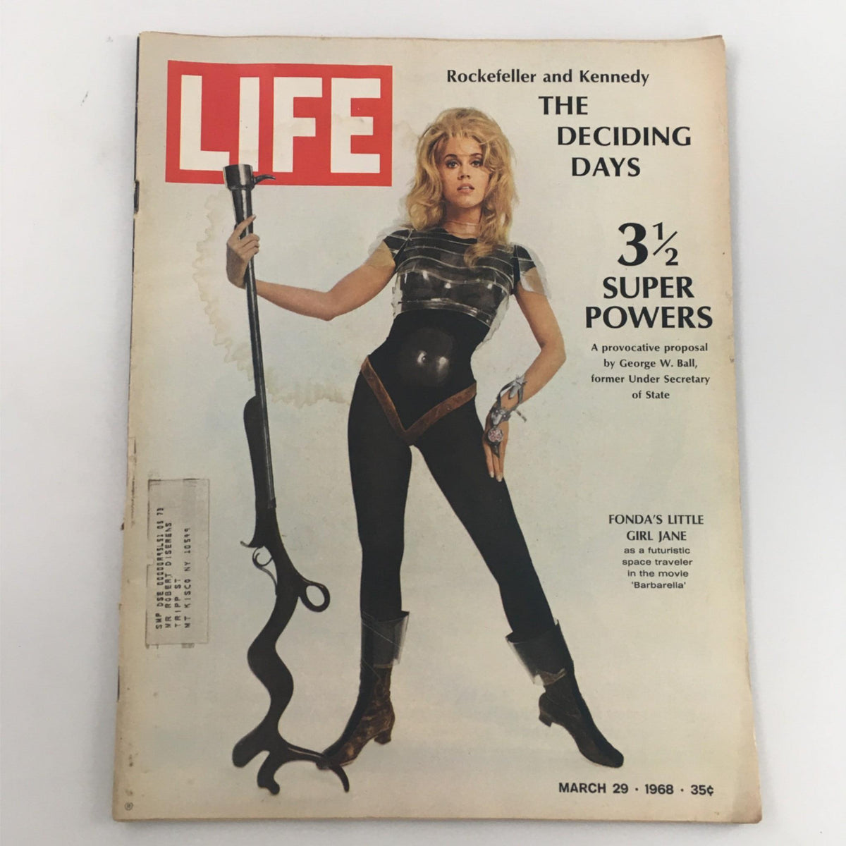 Cover of VTG Life Magazine from March 29, 1968 featuring Fonda's Little Girl Jane, with a striking image of a woman in a futuristic costume holding a blaster, complemented by the headline about George Ball's proposal on superpowers.