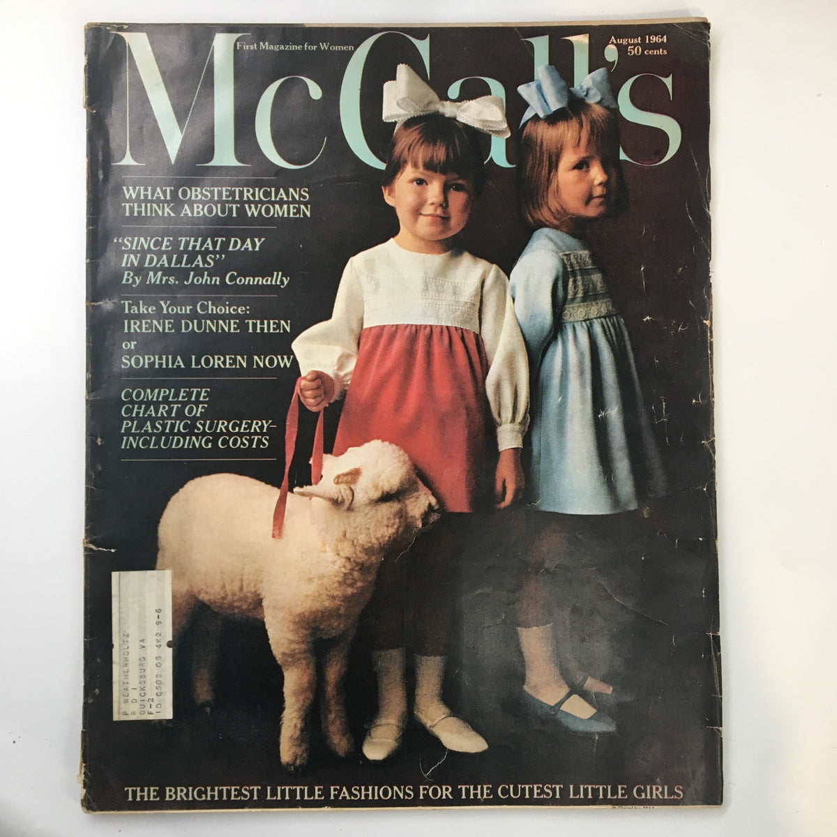 Cover of VTG McCall's Magazine August 1964 featuring two young girls in colorful dresses, one holding a lamb, showcasing the title 'Take Your Choice: Irene Dunne Then or Sophia Loren Now.'