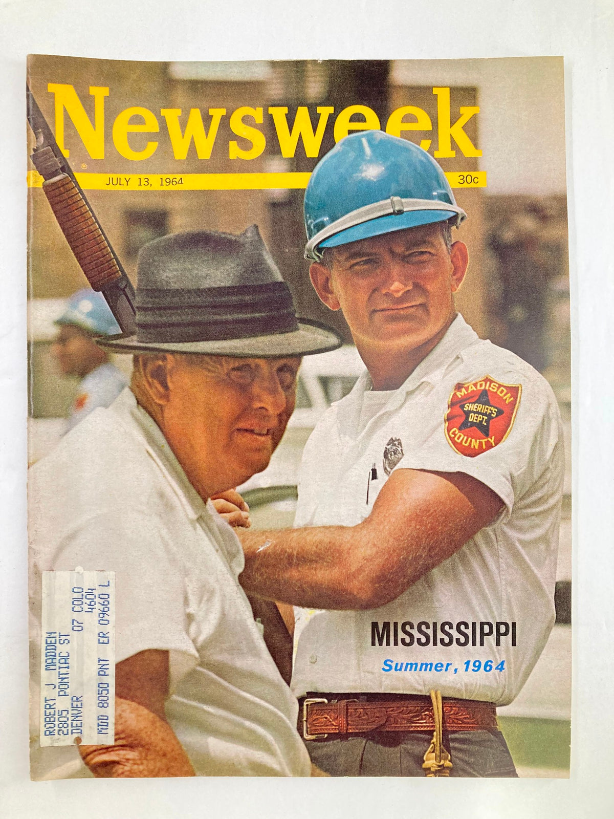 Cover of Vintage Newsweek Magazine dated July 13, 1964, featuring two men, one wearing a police uniform and helmet, discussing matters related to the Mississippi Summer of 1964.