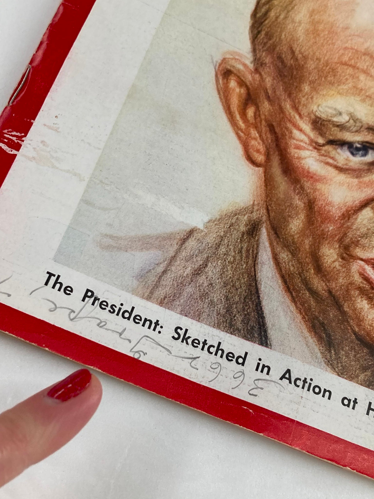 Close-up of the Vintage Newsweek Magazine cover from August 17, 1959, highlighting the title 'The President: Sketched in Action at His Press Conference' with a finger pointing at the text.