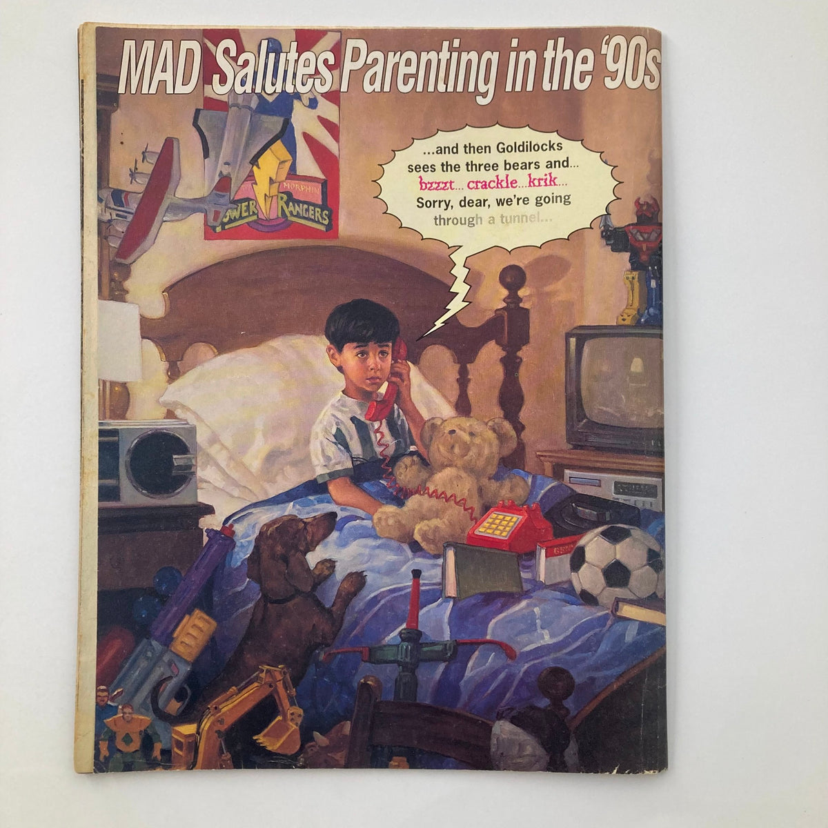 Cover of Mad Magazine January 1996, Issue #342, titled 'MAD Salutes Parenting in the ‘90s'. Features a child on a bed surrounded by toys, holding a phone, and a teddy bear, reflecting the humor and pop culture of the 1990s.