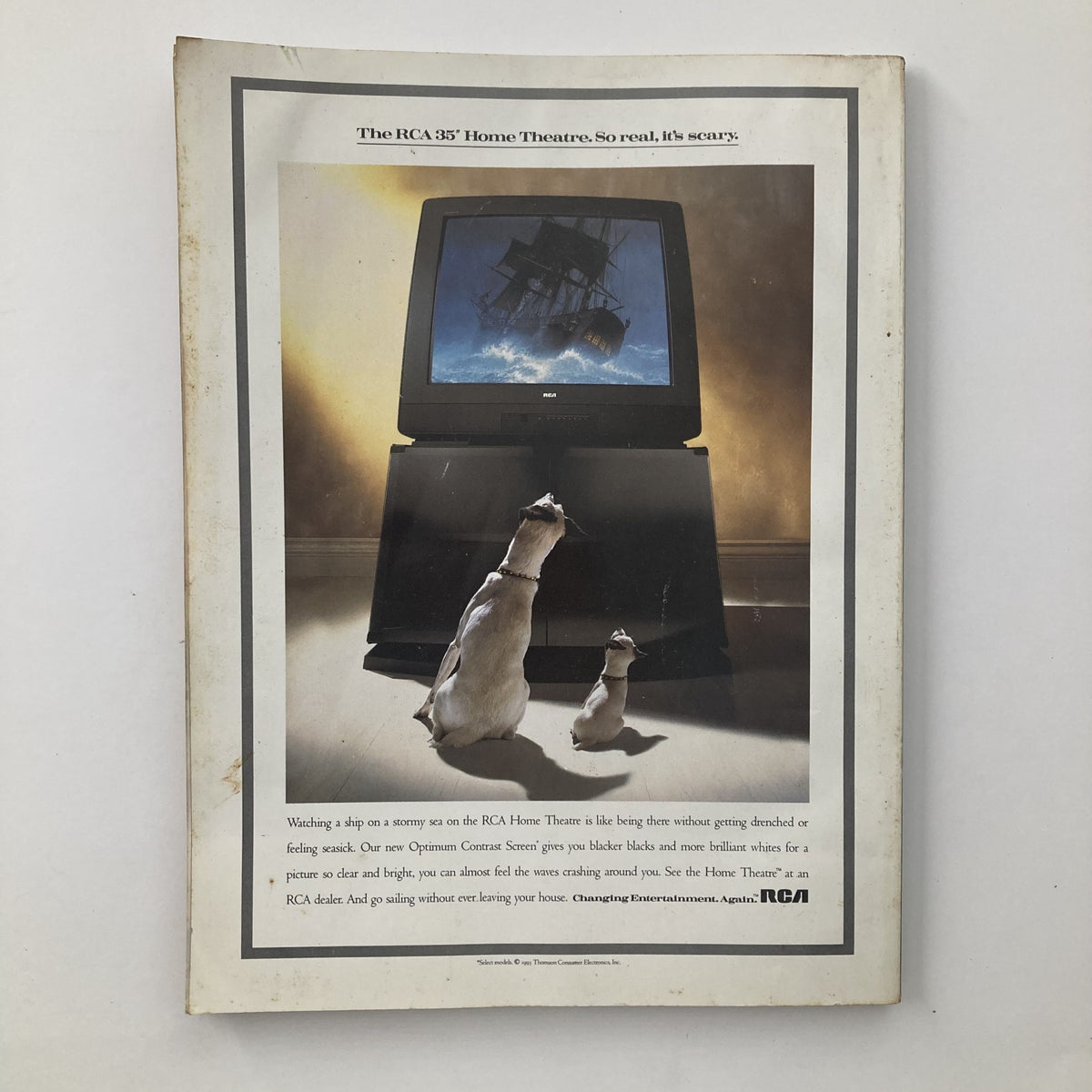 Back cover of Playboy Magazine December 1993 featuring an advertisement for the RCA 35' Home Theatre, showcasing two dogs watching a ship on the television.