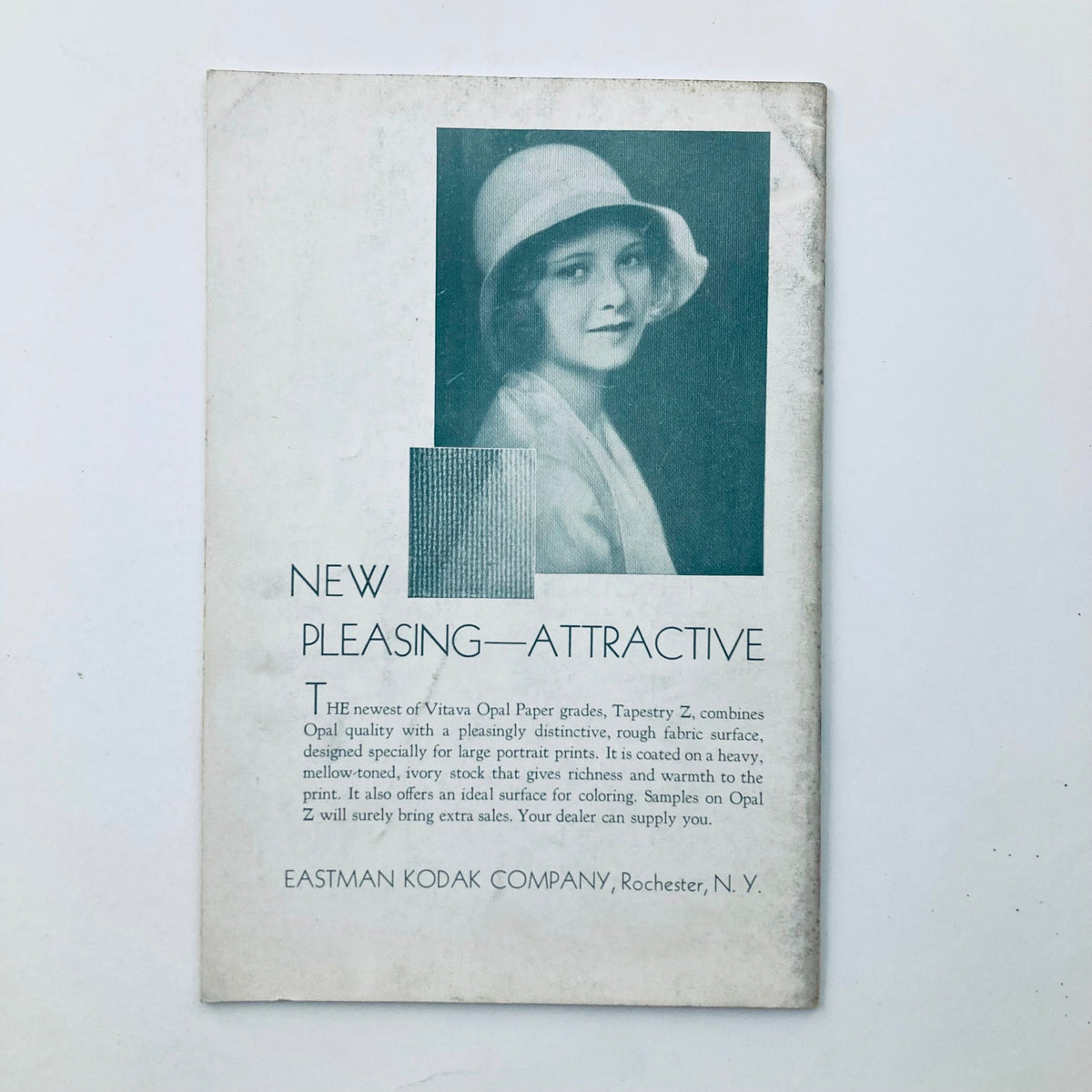 Back cover of VTG Photographic Review Magazine December 1932 Eastman Portrait, displaying an advertisement for Vitava Opal Paper grades, featuring a photograph of a woman in a hat and a textured graphic.