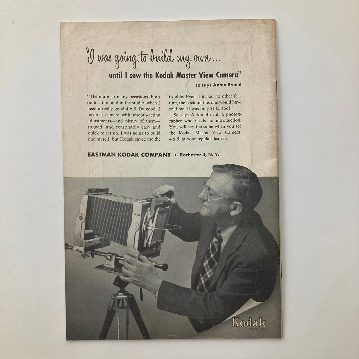 Back advertisement page of VTG Snap Shots Magazine October 1953 highlighting the Kodak Master View Camera with a man holding the camera.