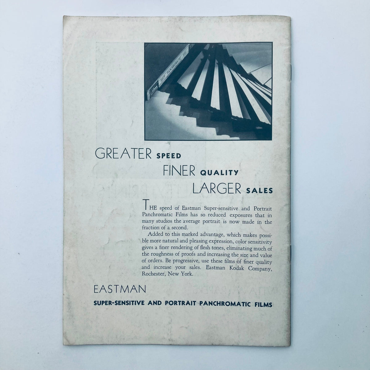 Back page of Studio Light Magazine May 1934 displaying advertisement content related to Eastman Super-sensitive and Portrait Panchromatic Films, emphasizing improved photographic quality.