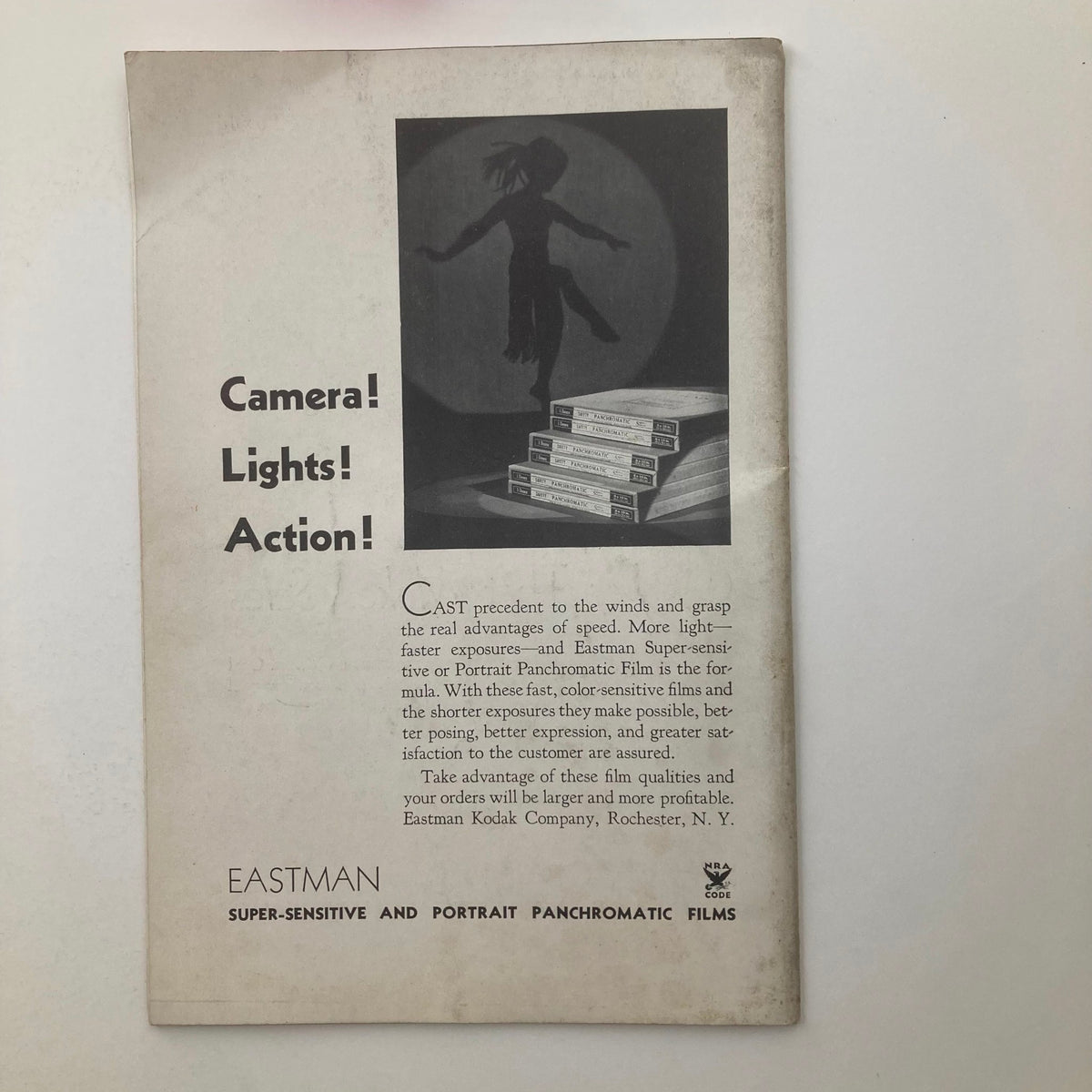 Back cover of VTG Photographic Review Magazine December 1934 featuring an advertisement for Eastman Super-sensitive and Portrait Panchromatic Films, highlighting advantages for film exposure with a dynamic graphic of a dancer.