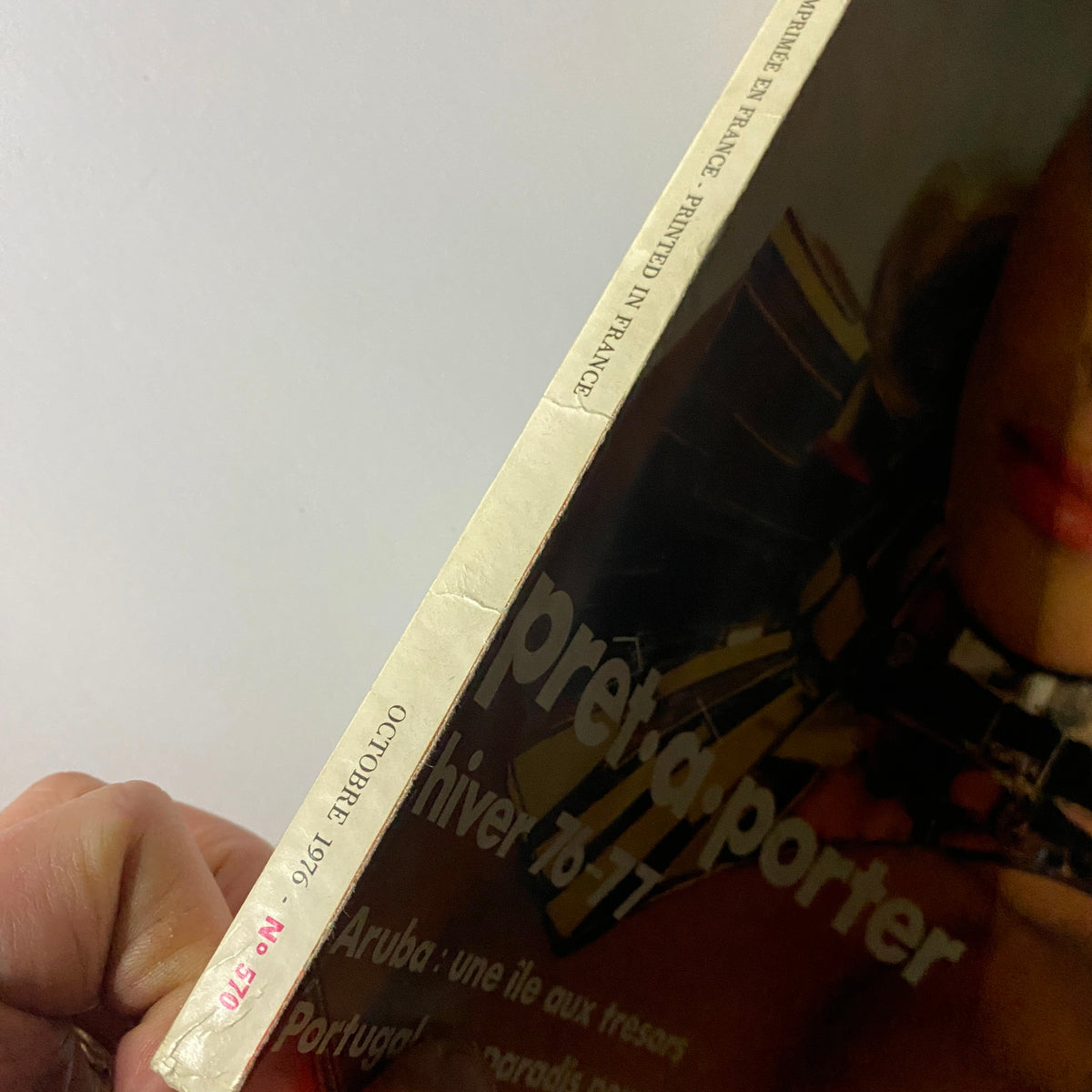 Side view of Vogue Paris Magazine October 1976 highlighting the spine and publication details, indicating excellent condition for a vintage collectible.