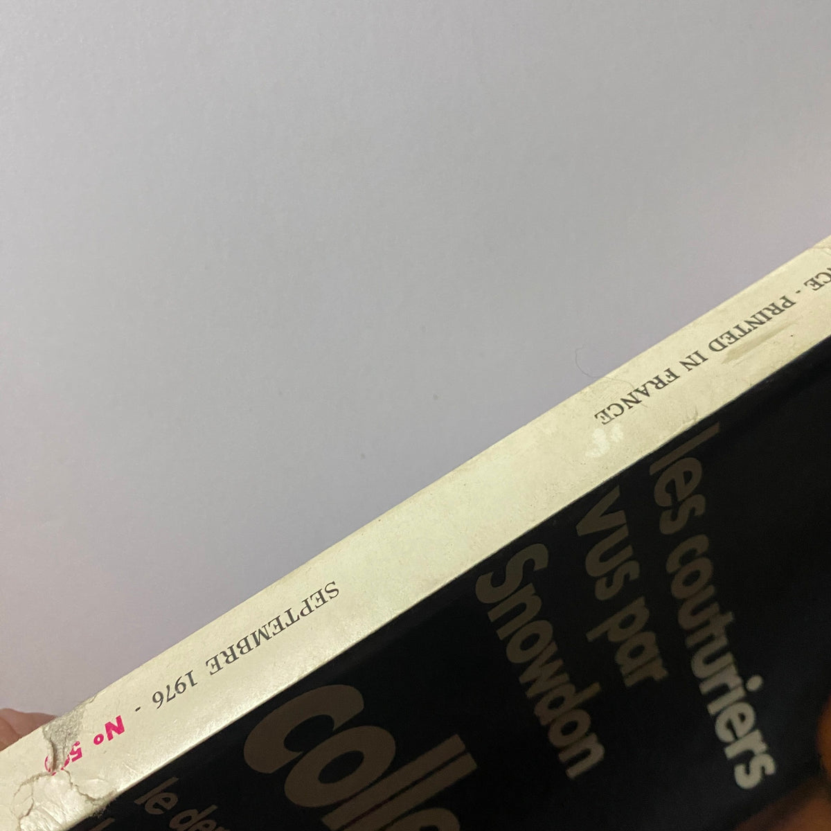 Spine view of Vogue Paris Magazine September 1976 displaying the publication's title and year, illustrating vintage magazine features.