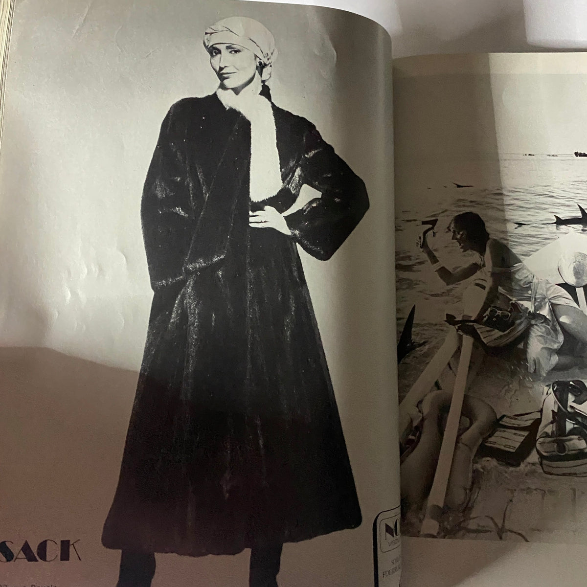 Black and white image of a model wearing a stylish coat and headscarf, featured in Vogue Paris Magazine September 1976 Dayle Haddon Cover, showcasing the elegance of vintage fashion.