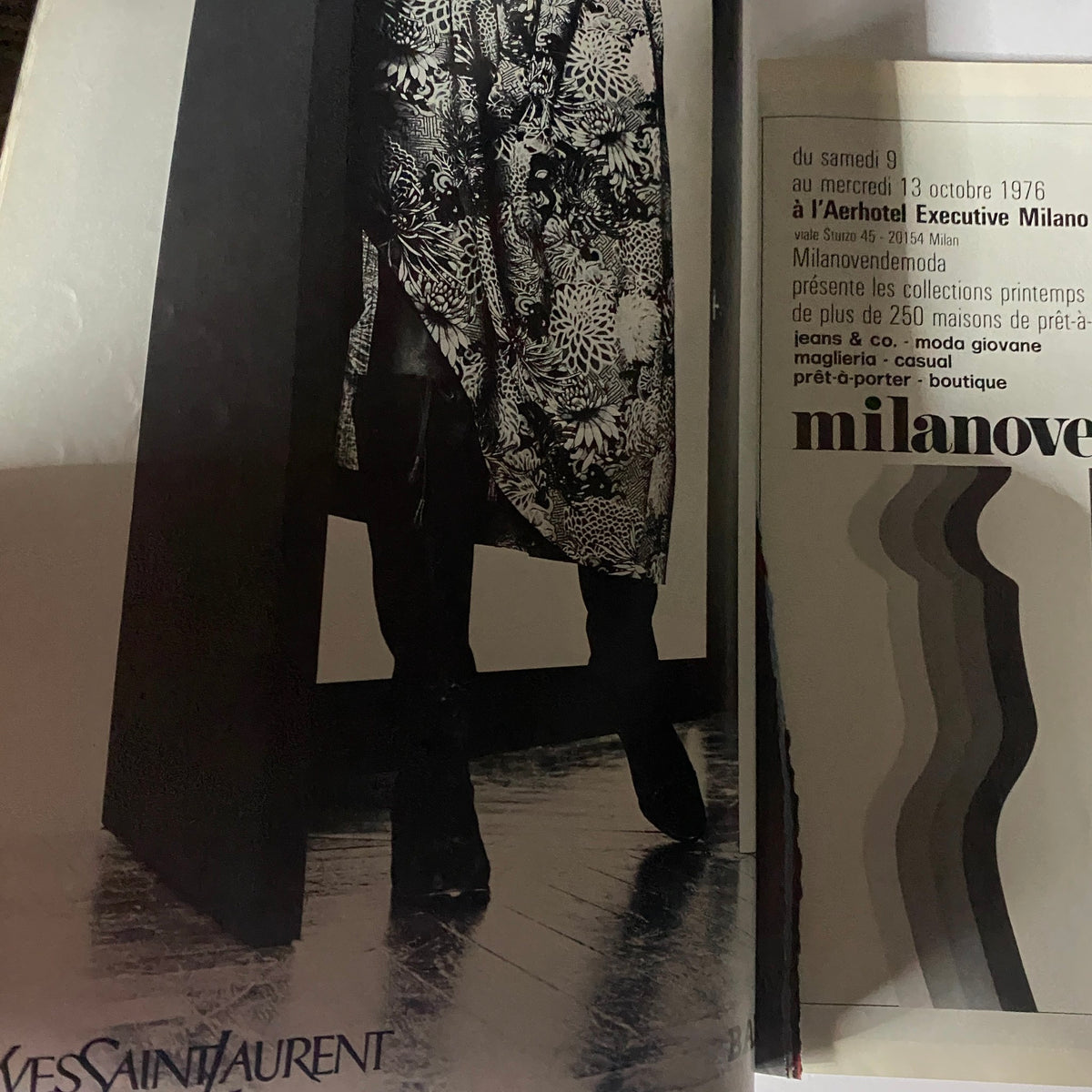 Yves Saint Laurent advertisement from Vogue Paris Magazine August 1976 showcasing a model in a distinctive floral-print outfit, representing the era's fashion aesthetics.
