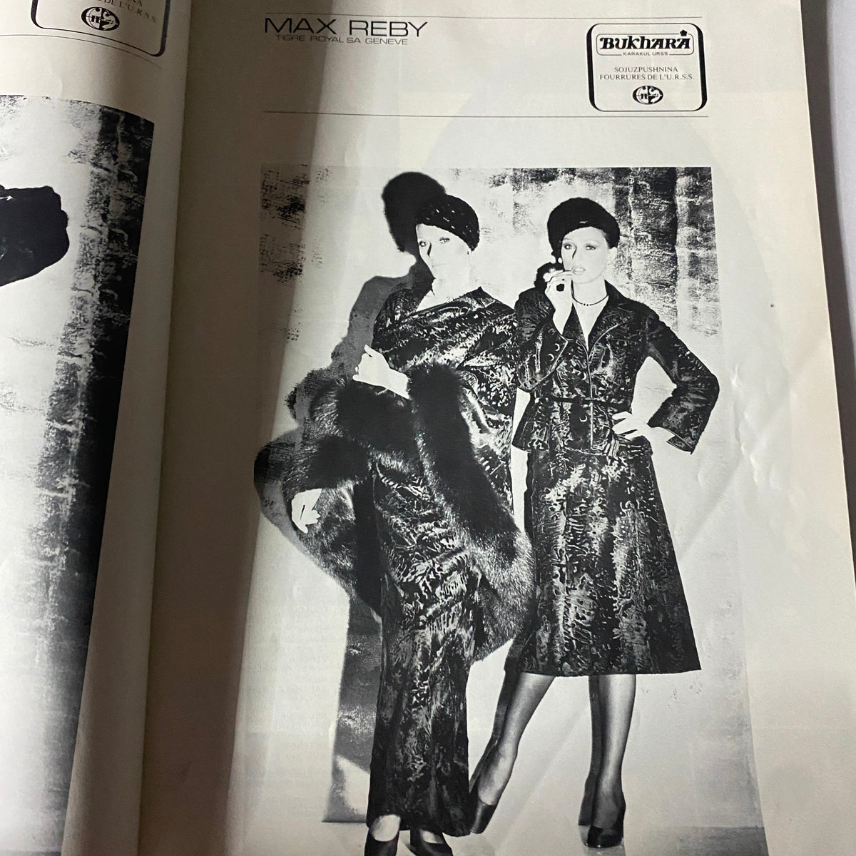Fashion advertisement in Vogue Paris Magazine June - July 1976 featuring models wearing sophisticated outfits, capturing the elegance and style of 1970s fashion photography.