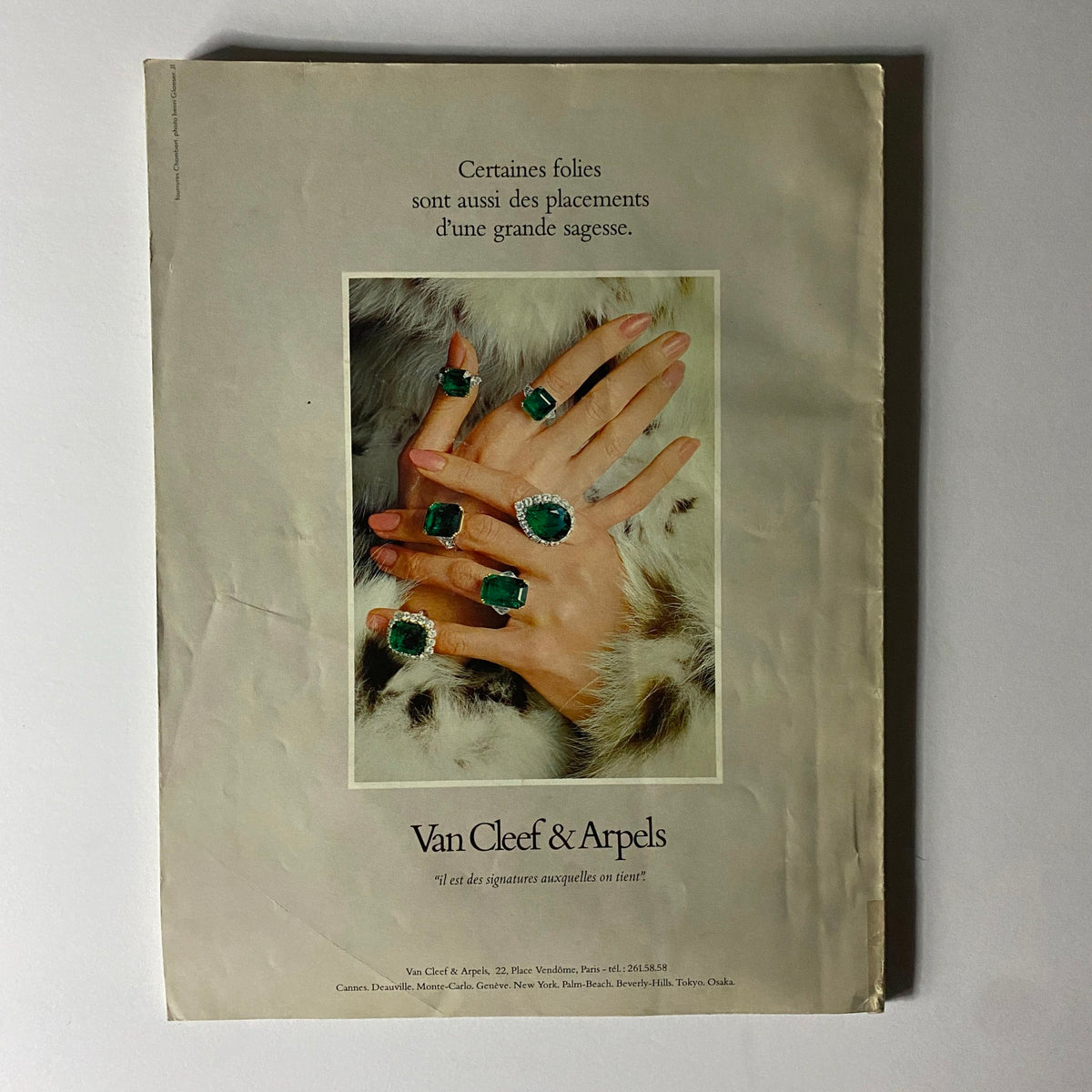 Jewelry advertisement from Vogue Paris Magazine June - July 1976, displaying Van Cleef & Arpels rings with emerald and diamond designs, reflecting timeless luxury.