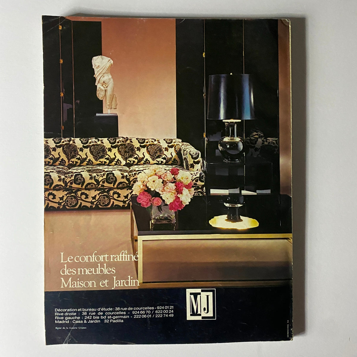 Vintage advertisement for French furniture from MJ in Vogue Paris Magazine April 1976 with Dalila Di Lazzaro on the cover, depicting refined design elements for home decor.