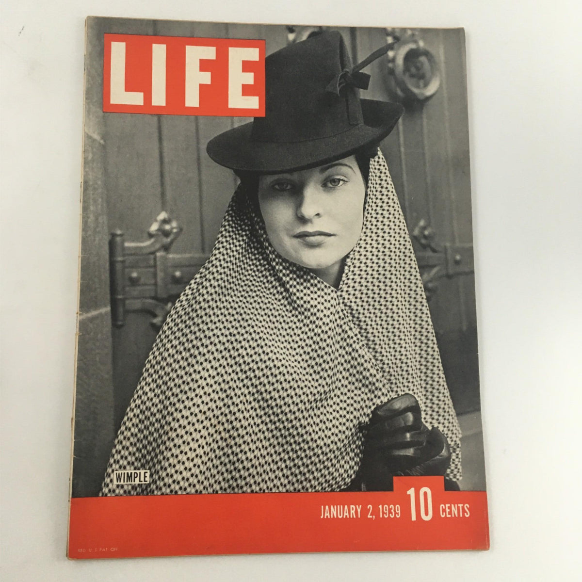 Cover of Life Magazine January 2, 1939 featuring a woman in a hat and scarf, with the title 'LIFE' prominently displayed. This vintage magazine showcases Wimple and offers a glimpse into the style and culture of 1930s America.