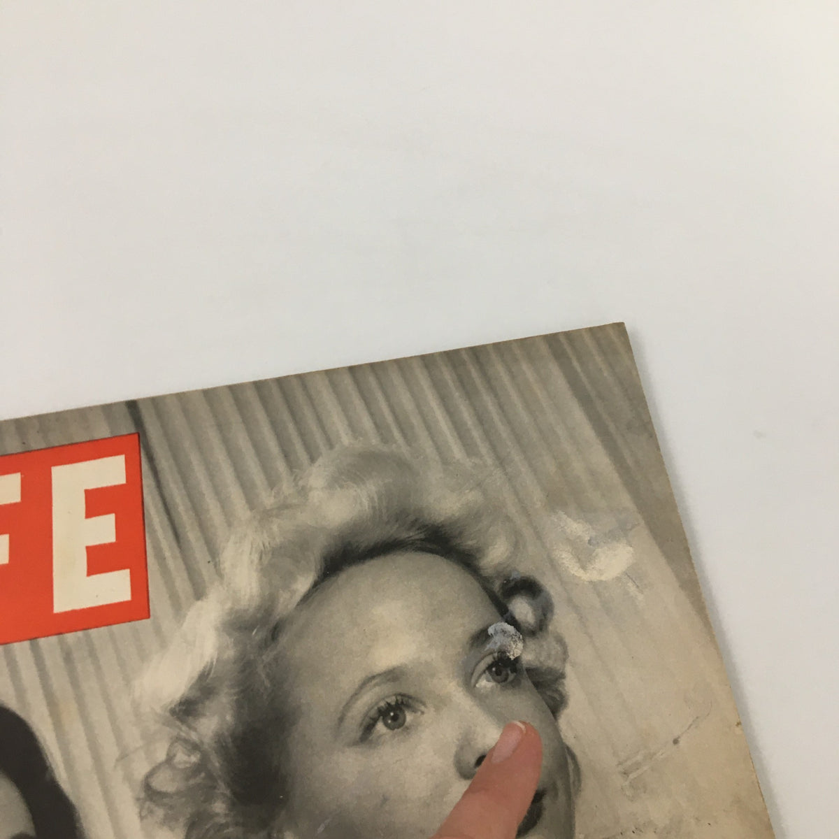Close-up view of the VTG Life Magazine cover from March 1, 1943, highlighting a woman in a bow tie with minor wear visible.