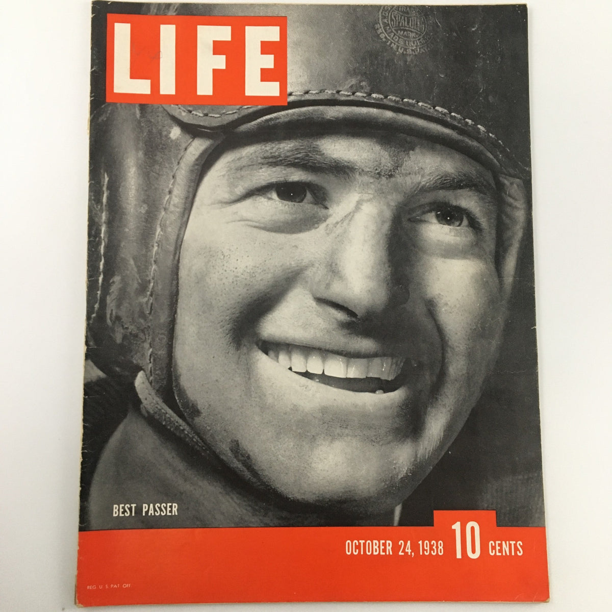 Vintage Life Magazine cover from October 24, 1938, featuring a smiling Sid Luckman, recognized as the best passer in football history, showcasing the cultural essence of late 1930s America.