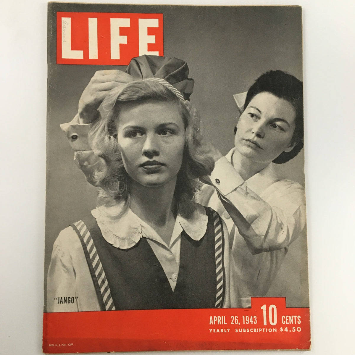 Cover of VTG Life Magazine from April 26, 1943, showcasing a black and white photo of a woman getting her hair styled, with 'JANGO' caption and vibrant red title.