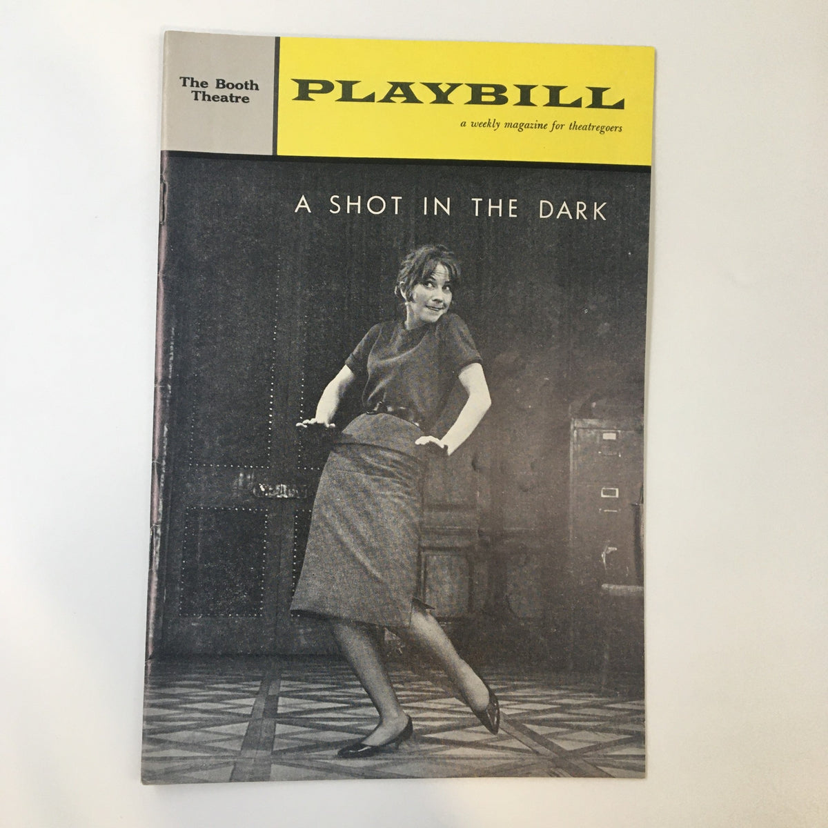 1962 Playbill for 'A Shot In The Dark' at The Booth Theatre featuring a stylish actress in black and white.