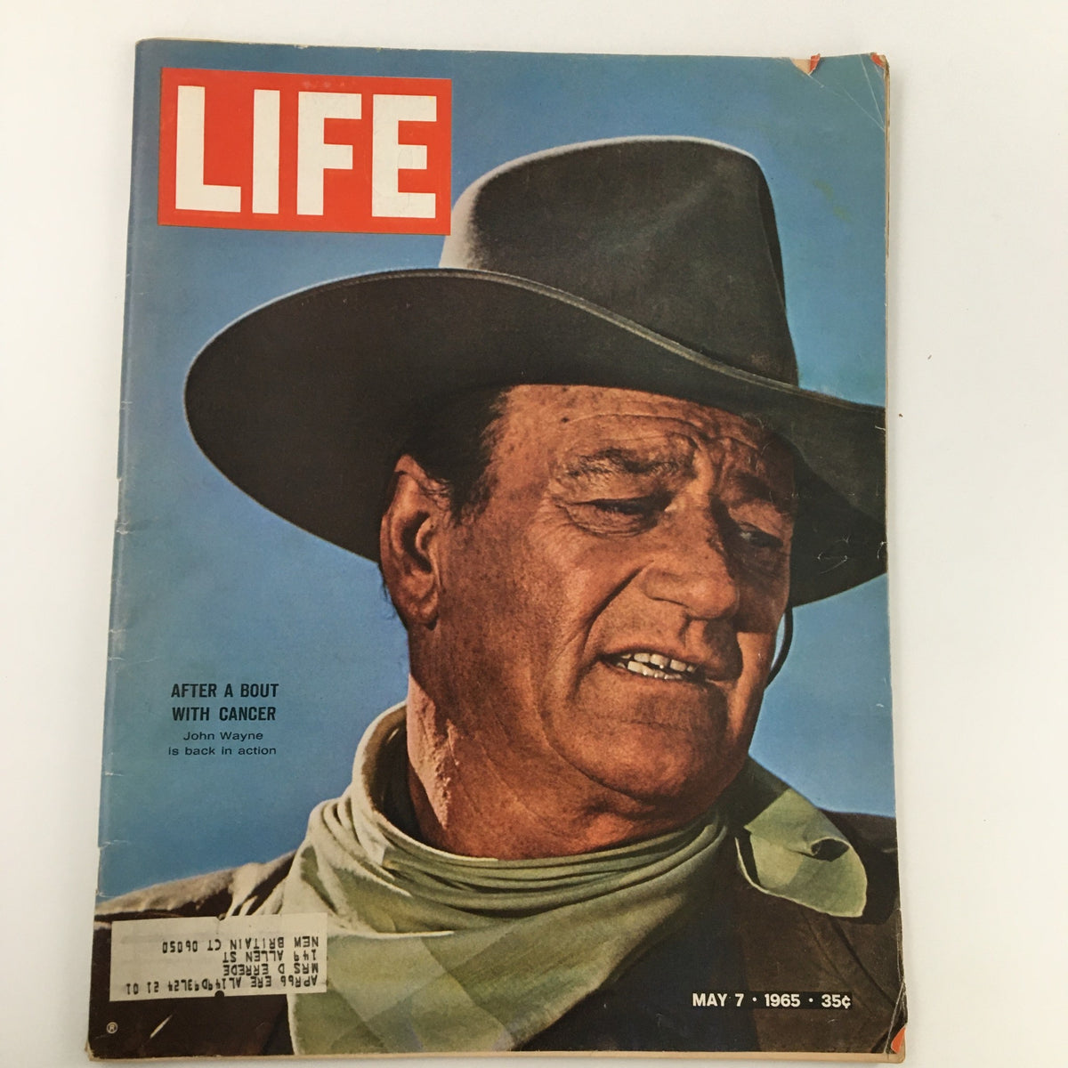 Cover of VTG Life Magazine dated May 7, 1965 featuring John Wayne after a bout with cancer, showcasing a portrait of Wayne in a cowboy hat and scarf against a blue sky.