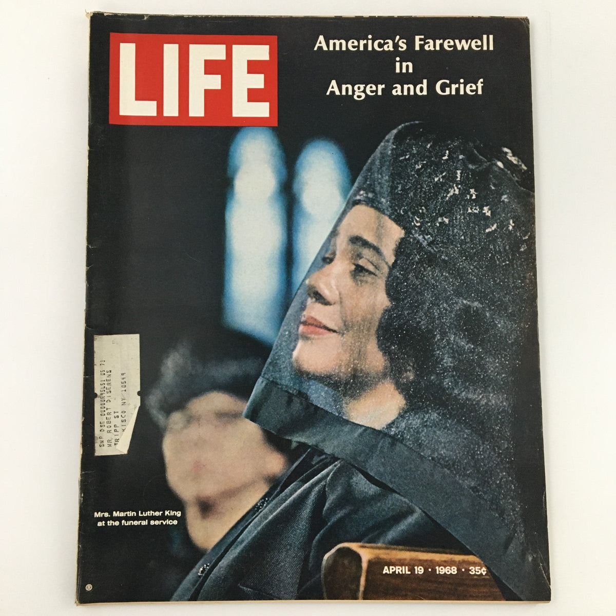 Cover of Vintage Life Magazine dated April 19, 1968, titled 'America's Farewell in Anger and Grief,' featuring a poignant image of Mrs. Martin Luther King at a funeral service. This magazine reflects the emotional turmoil of America during this significant historical period.