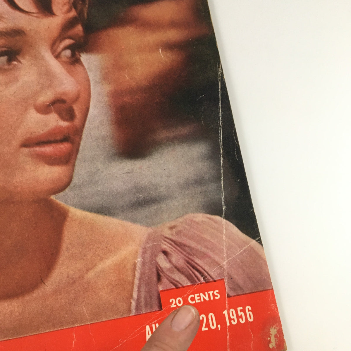 Close-up of the cover of Life Magazine dated August 20, 1956, featuring Audrey Hepburn in 'War and Peace', showcasing her iconic presence and the magazine's vintage condition.