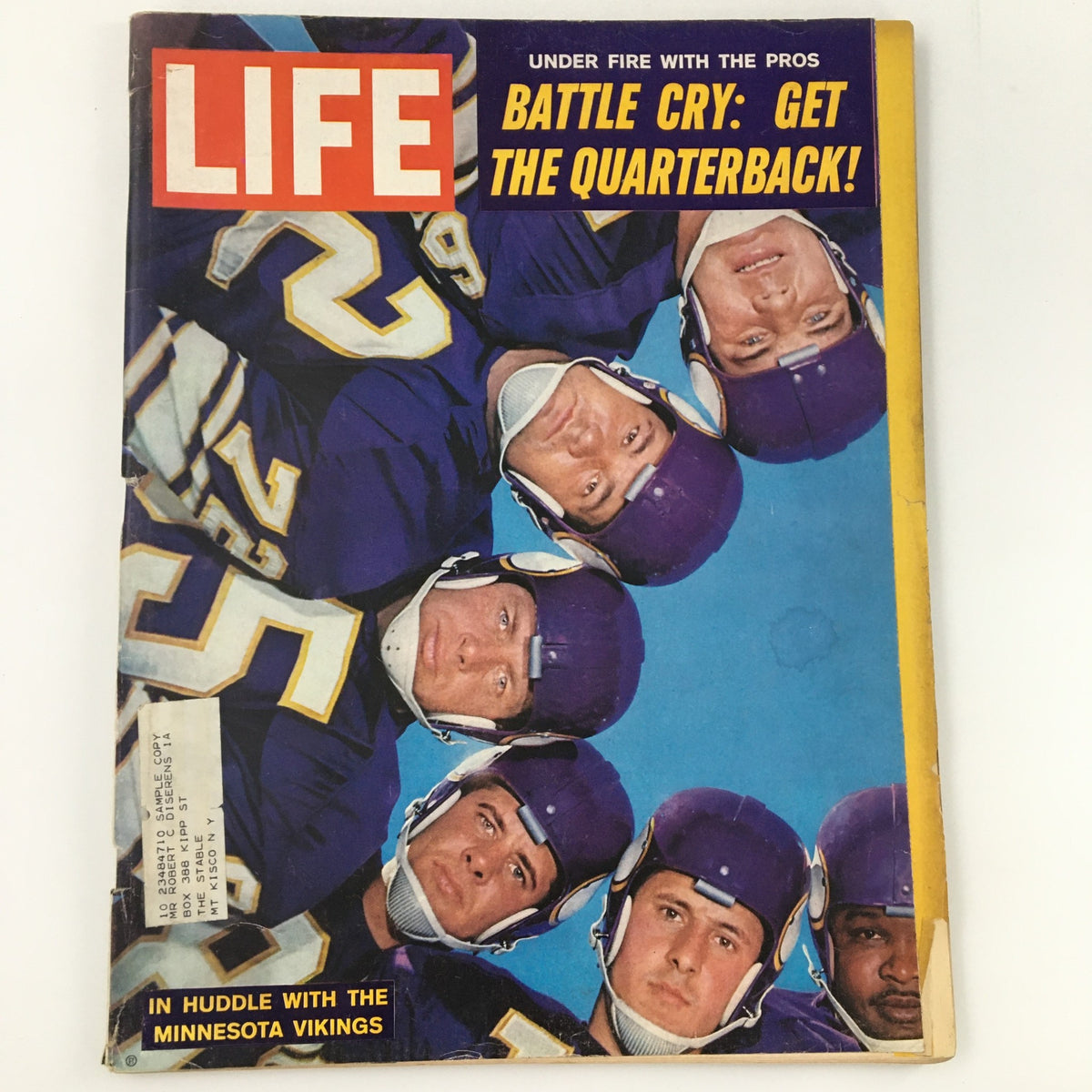 VTG Life Magazine November 17 1961 cover featuring Minnesota Vikings players in huddle, showcasing their iconic purple jerseys and the headline 'Battle Cry: Get the Quarterback!'. A historical snapshot of NFL history.